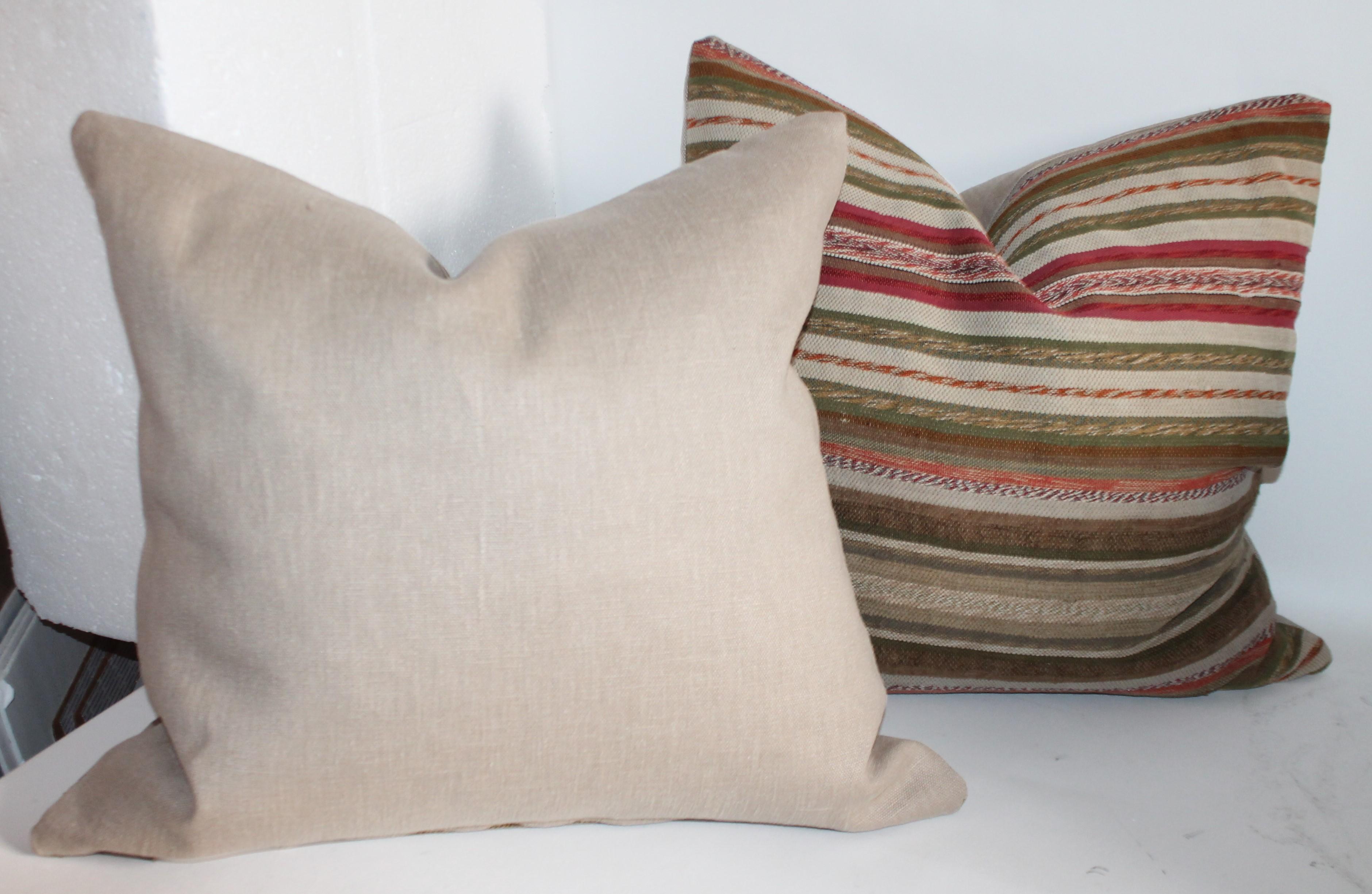 These fantastic early New England rag rug pillows are in fantastic condition and have taupe cotton linen backings. Sold as a pair. Two pairs in stock.