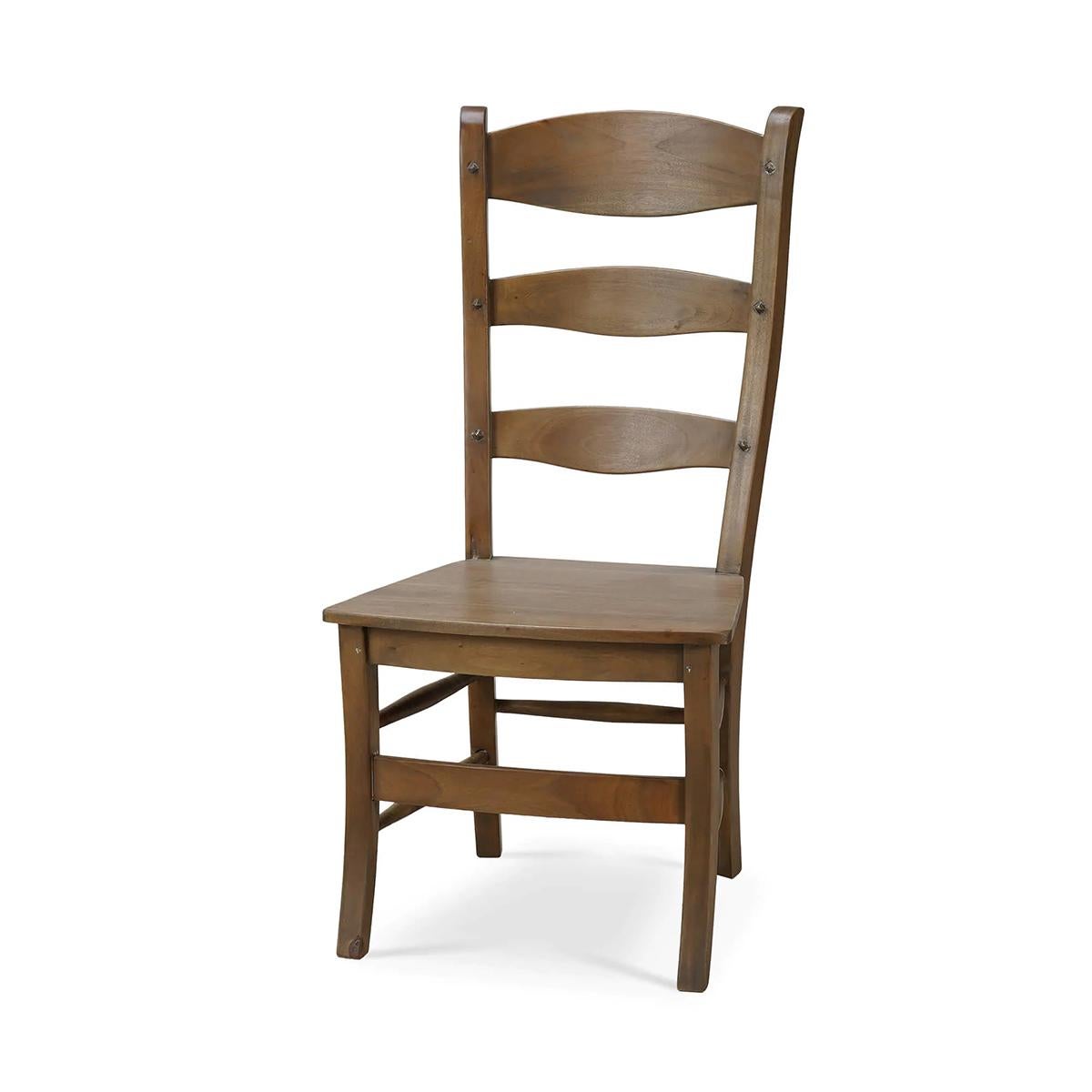Featuring a classic ladder-back design and distinctive pegged construction, this chair showcases a handcrafted appeal that enhances any dining space. Finished in a rich Mahogany Straw Wash, the chair highlights the natural beauty of the wood grain,