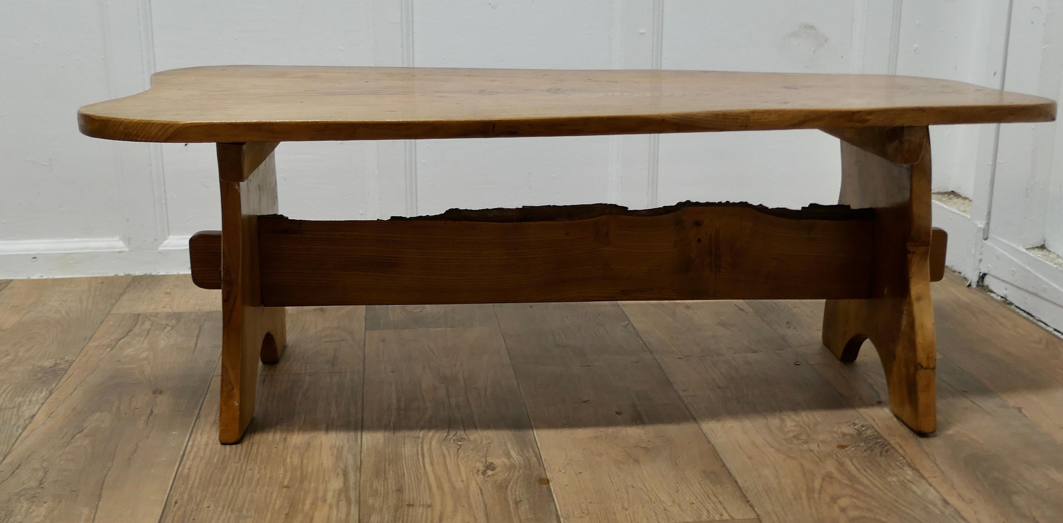 Country Elm Refectory Coffee Table

This is a good sturdy country made table, it has an 1” thick solid elm top which has very attractive figuring, a large slice of elm in the shape it was cut from the tree. The sturdy refectory style legs have a