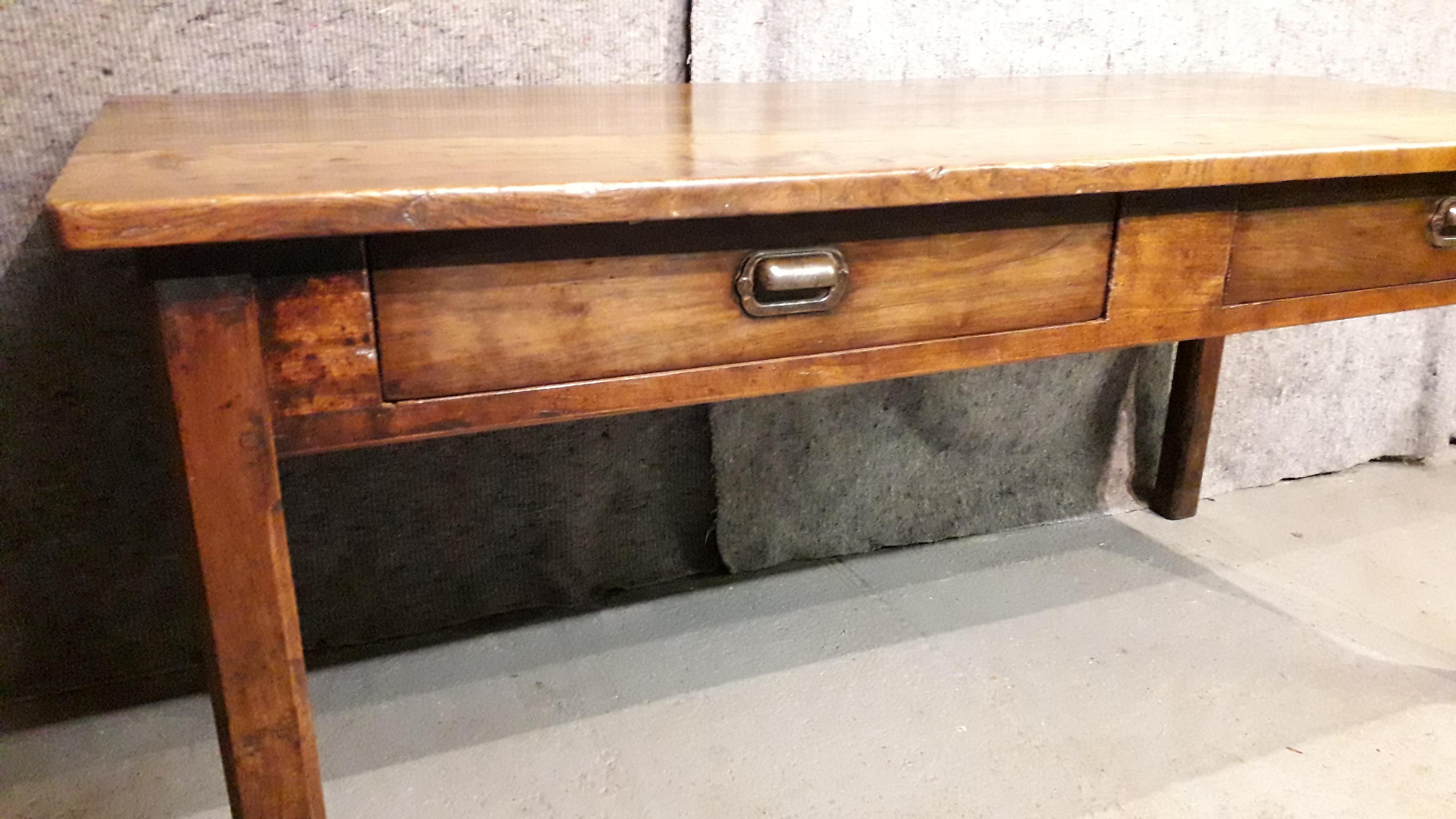A fabulous refectory table, the base made in cherry with a beautiful elm top, the side drawers internals have been restored and painted fresh white to finish.
Great cutlery and mat storage with excellent iron pull handles, the square chambered legs