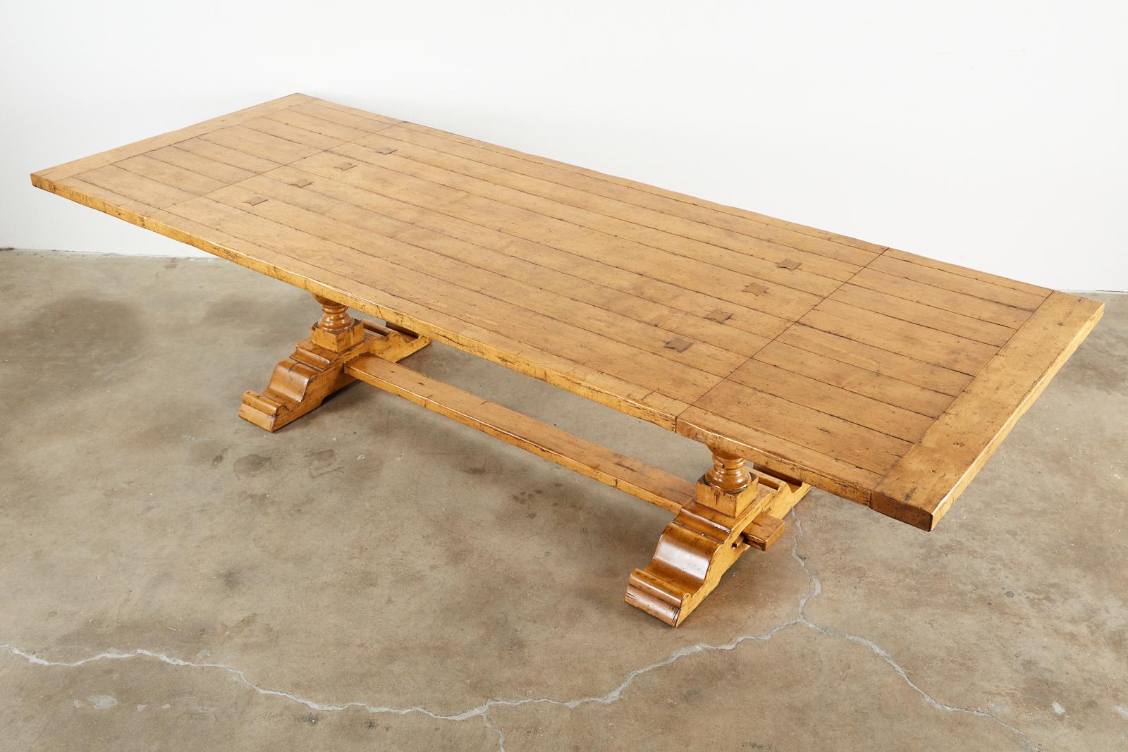 Large double pedestal trestle dining table made by Guy Chaddock. Bespoke table constructed from maple with an intentionally distressed finish and patina. Made in the country English style with two matching leaves that extend the table from 84 inches