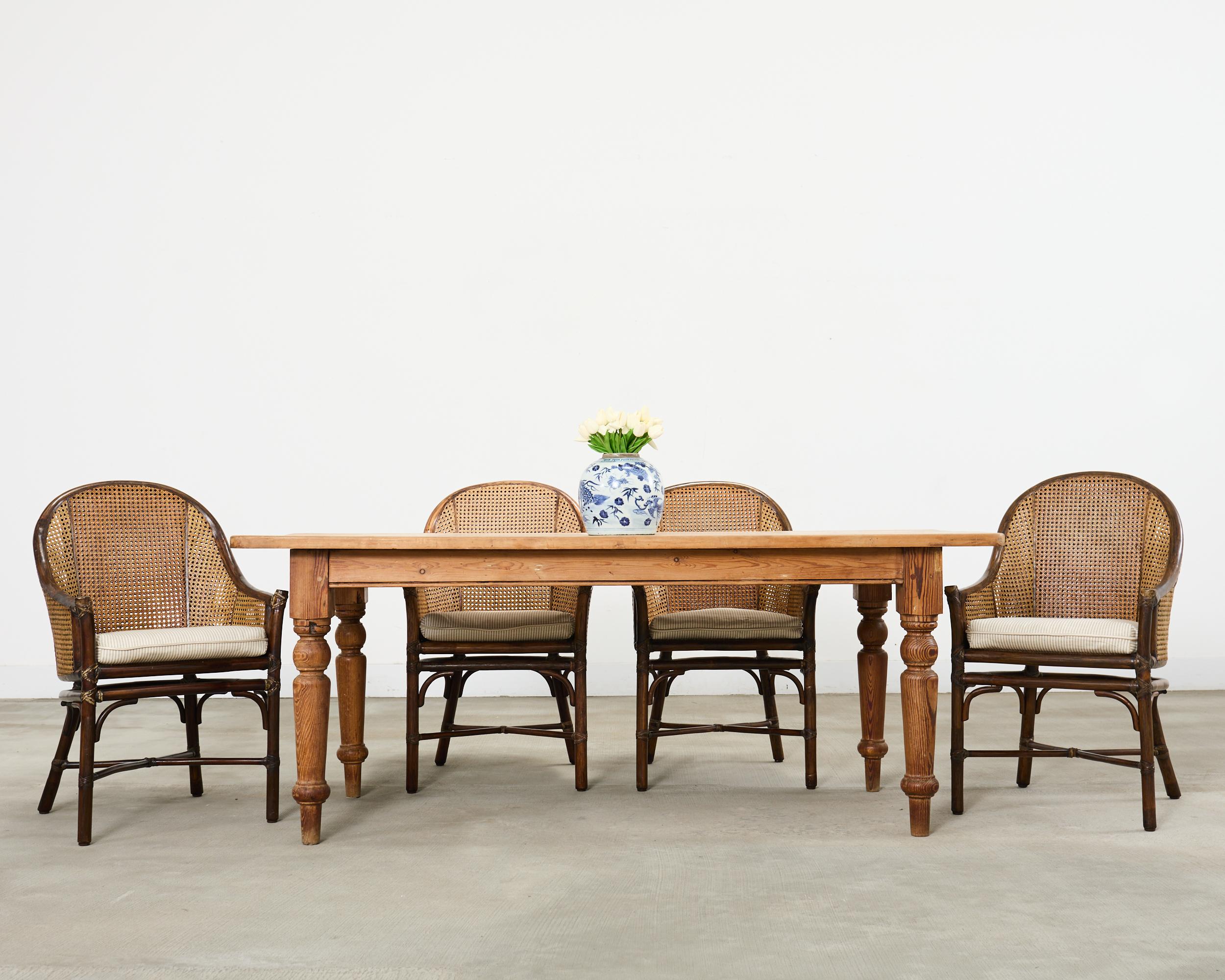 Rustic country English provincial style farmhouse dining table crafted from solid pine. The table features a thick plank top with boards measuring over 1 inch thick. The top is supported by chunky hand-turned baluster legs ending with peg feet. The