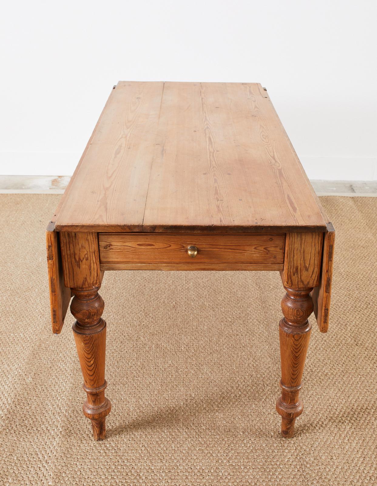 Country English Provincial Pine Farmhouse Drop Leaf Dining Table In Distressed Condition In Rio Vista, CA