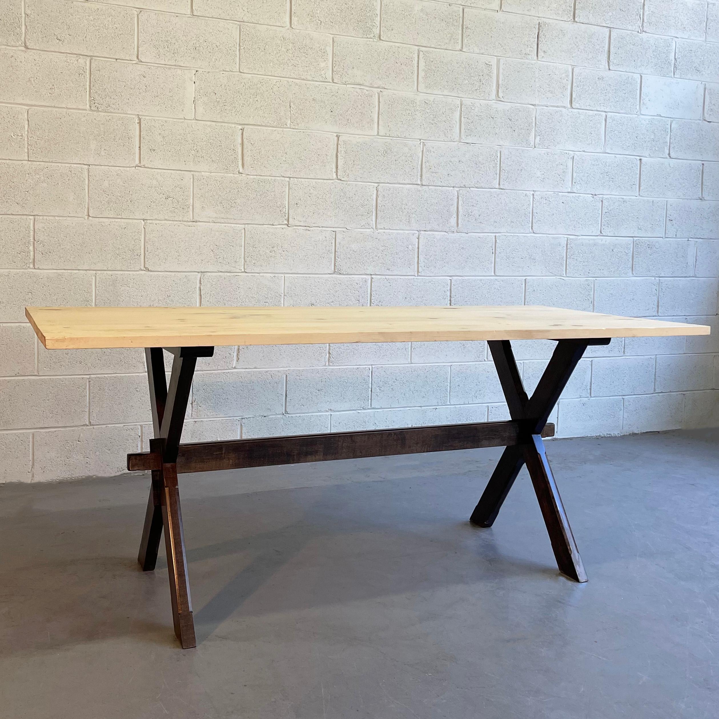 cFsignature, country, farm table features a maple trestle, X base with pine top. The top is unfinished and can be finished to spec for an additional $300. The table seats 6 for dining or can be used as a desk or work table. Made in Brooklyn by