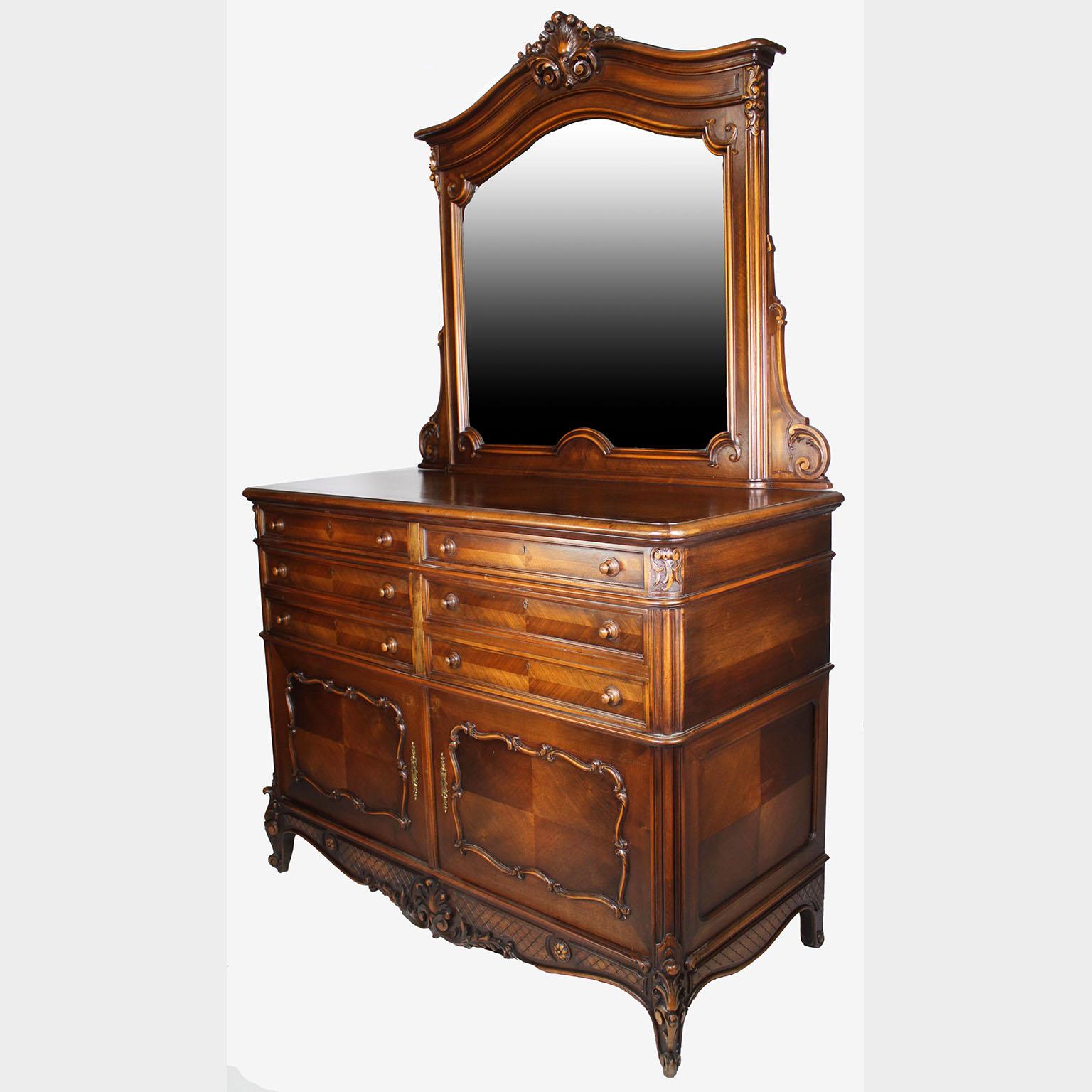 A Country French 19th/20th Century Louis XV Provençal Style Carved Walnut Vanity Dressing Table with Drawers. The large commode cabinet with six upper drawers above a twin-door compartment fitted with a wooden shelf. The lower apron carved with a