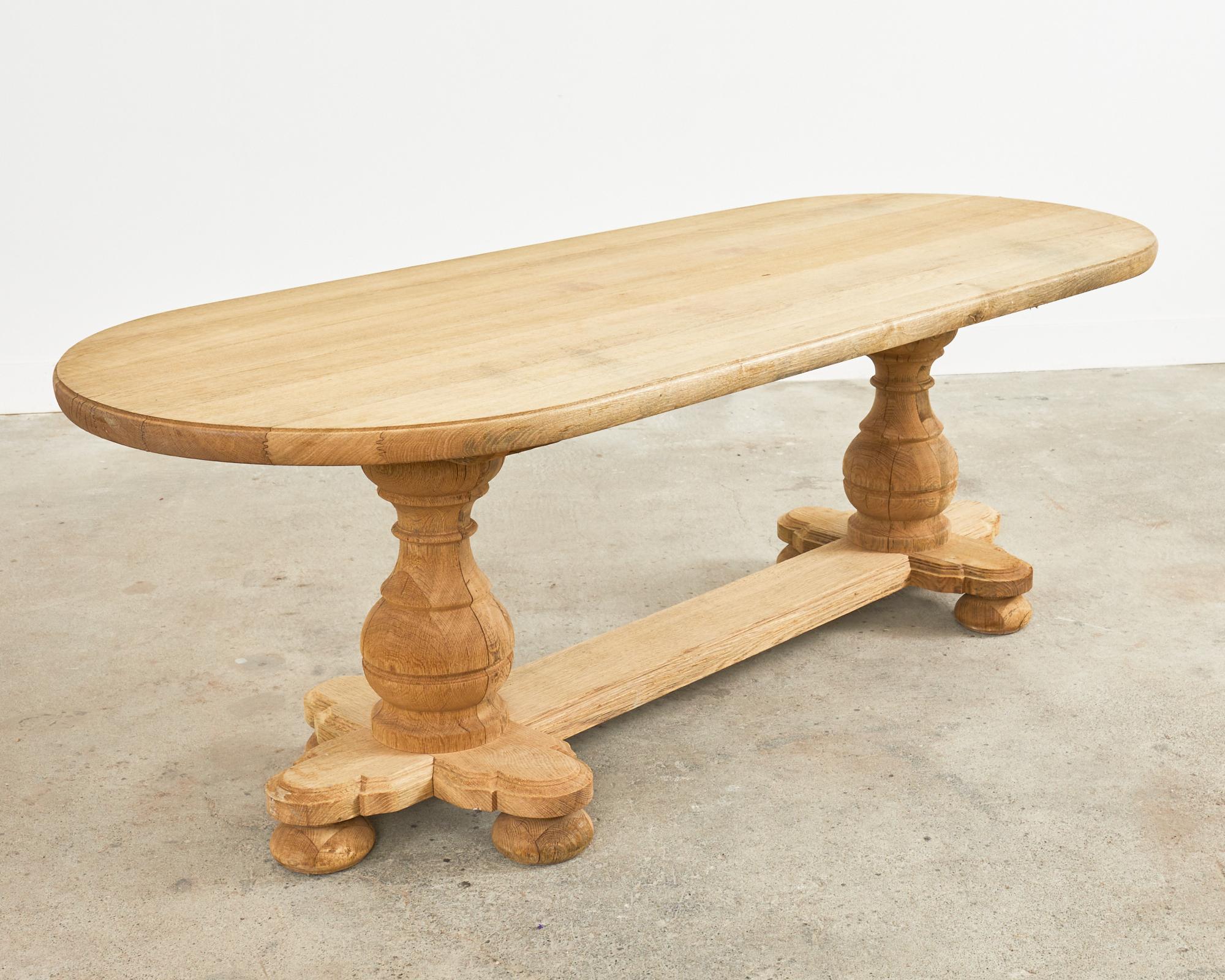 20th Century Country French Bleached Oak Oval Farmhouse Trestle Dining Table