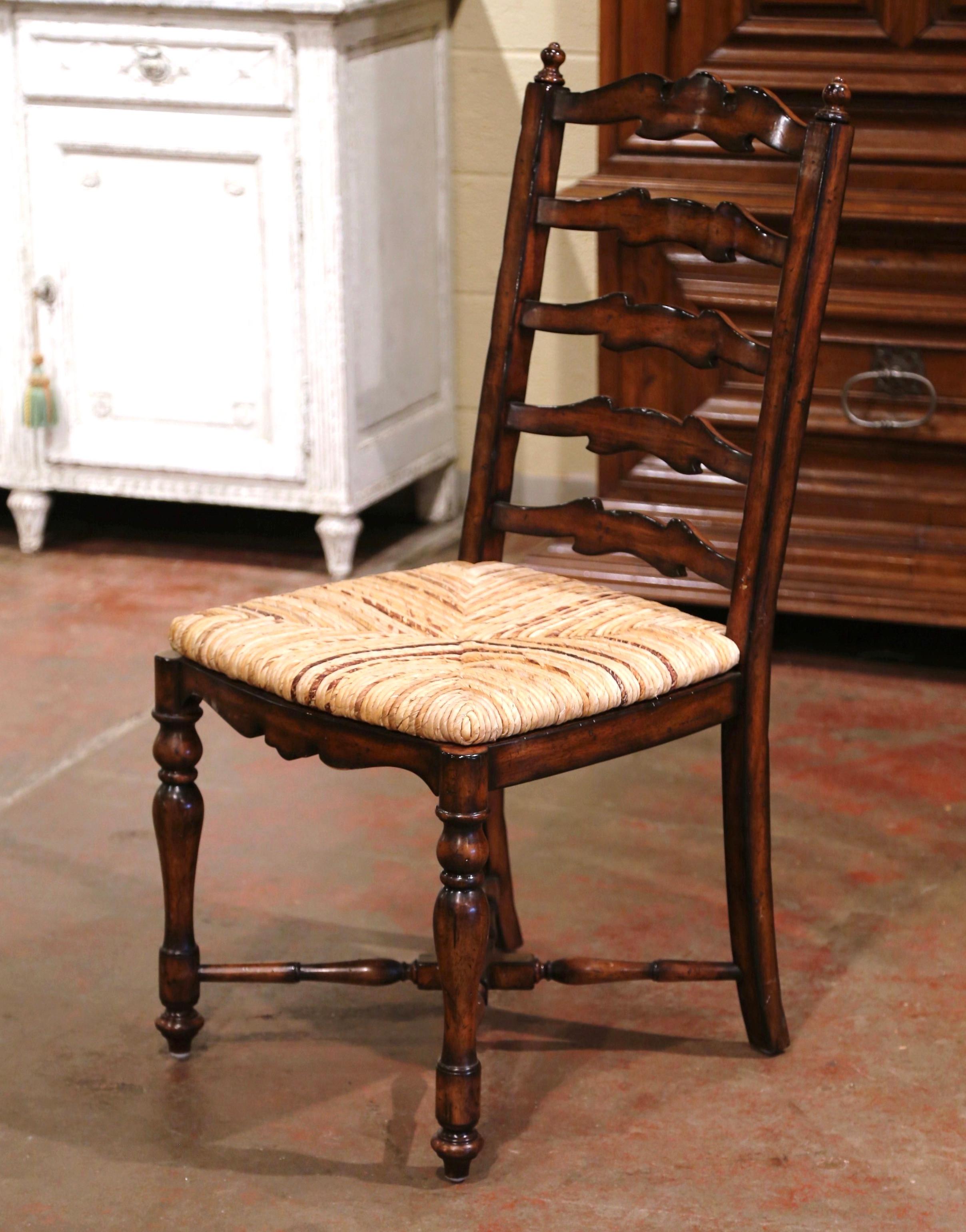These six elegant country chairs were crafted in France, circa 2000. Carved from solid walnut, each large chair stands on turned front legs and curved back legs, all connected with a bottom 