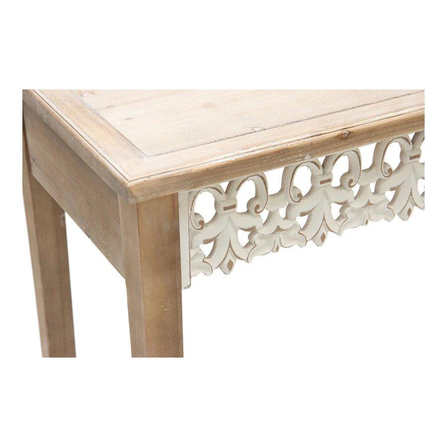 This is a functional, hand carved hall table that is also eye catching and elegant. A carved wooden Fleur De Lis front apron adds a splash of interest and soft whimsy to its otherwise straight utilitarian lines. The top is made from lightly white