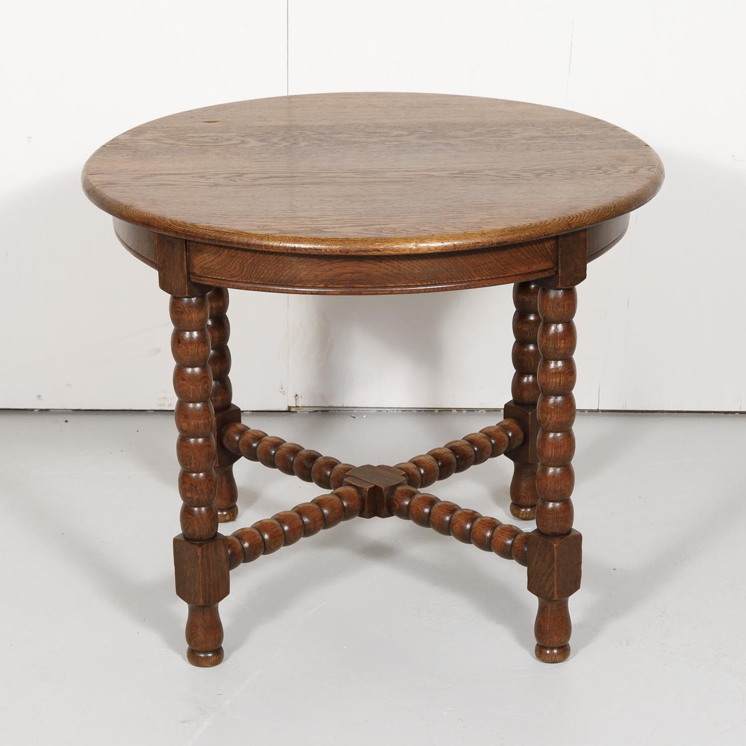 Vintage country French Louis XIII style round bobbin leg side table constructed of oak in the Normandy region, circa 1950s.

Dimensions:
Height 24