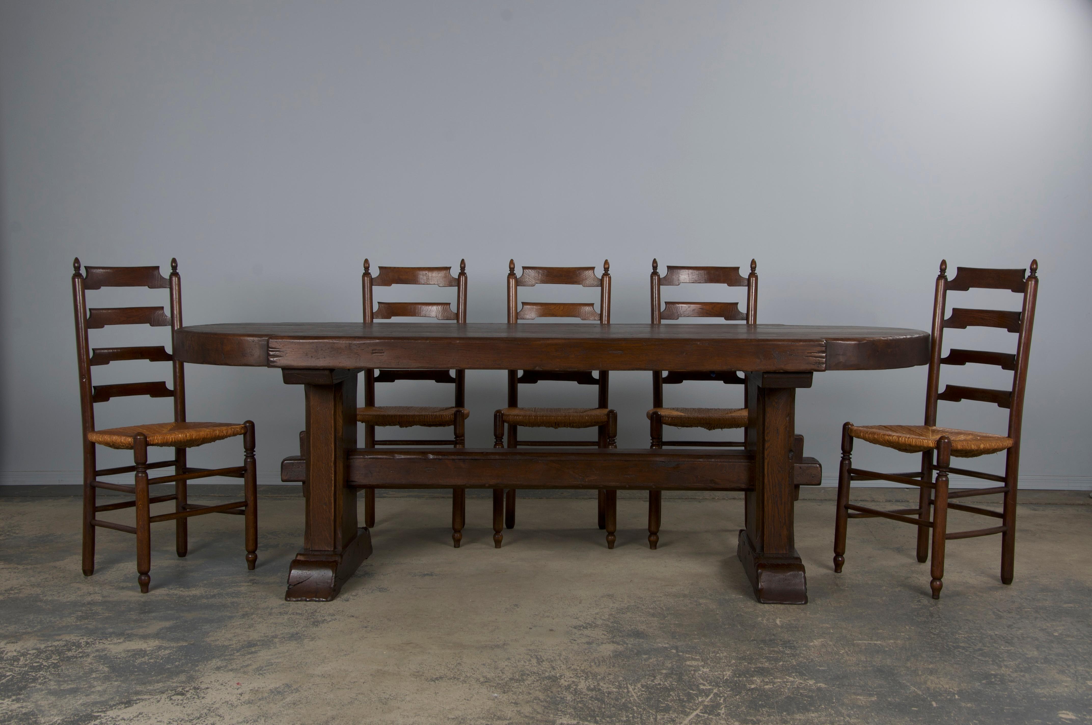 Vintage French monastery-style dining table sourced from Provence, France. Handcrafted from solid oak, it features a 7'2
