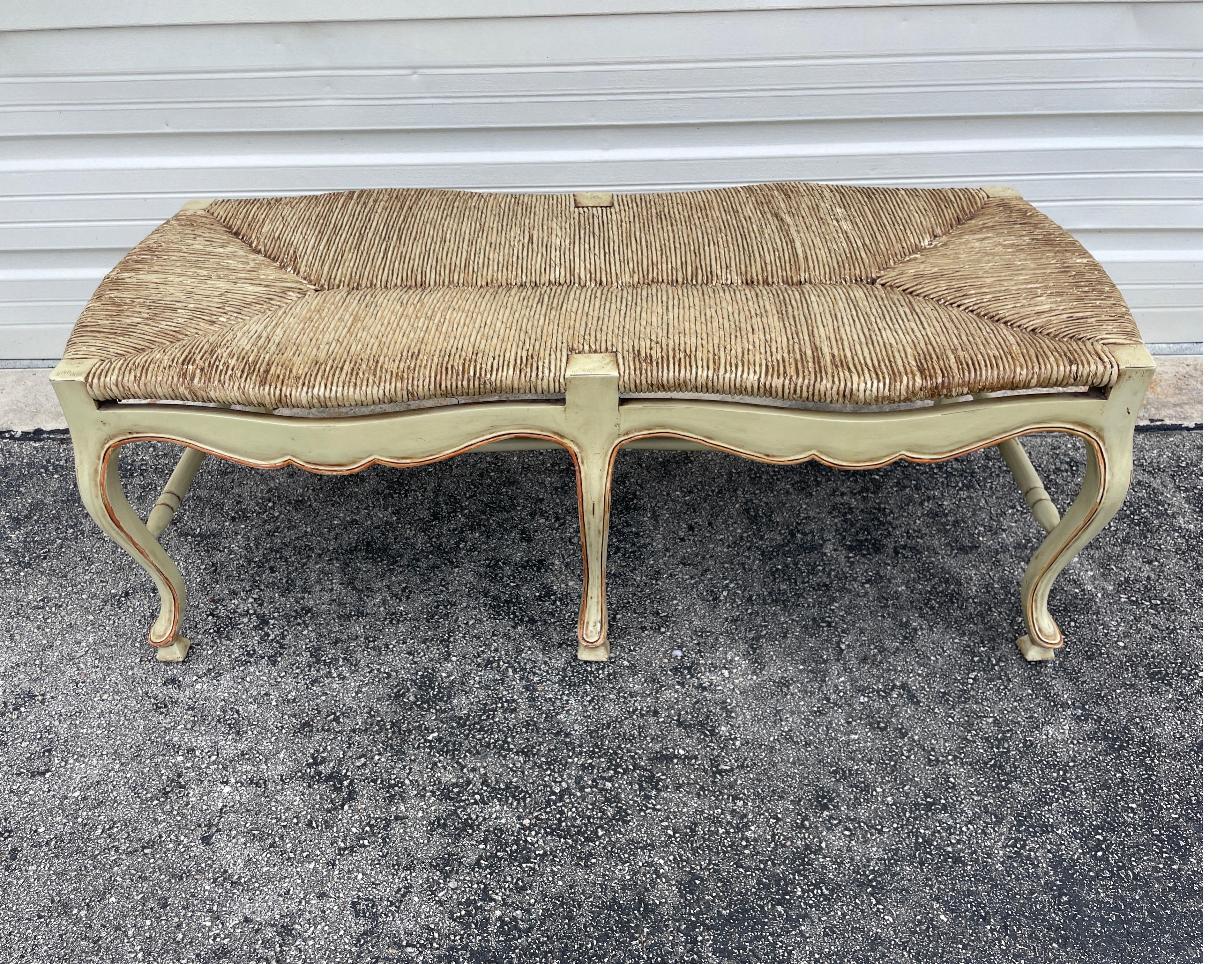 Country French Style painted bench with rush seat. A lovely curved apron frame supported by six legs. Very sturdy.