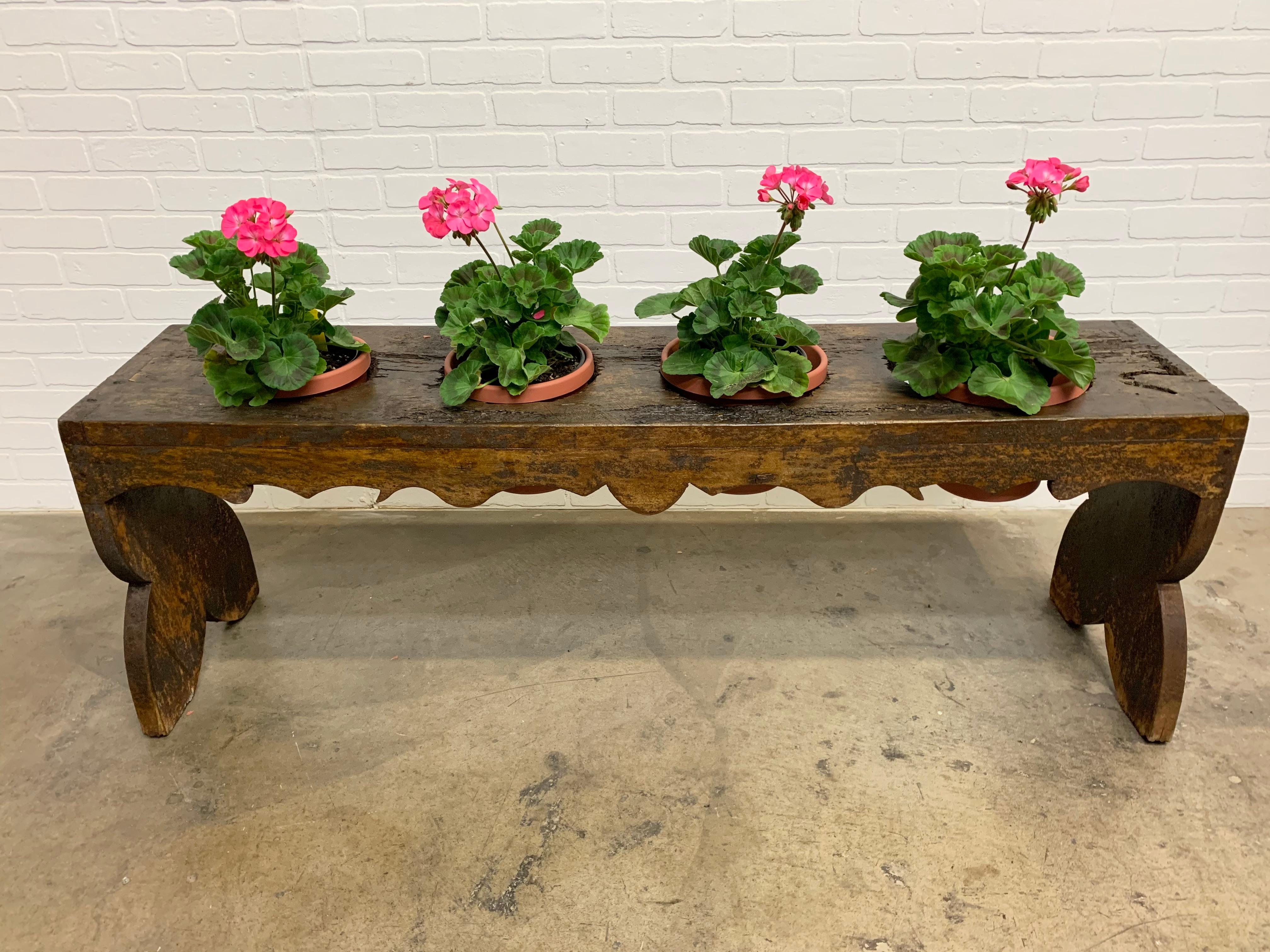Antique rustic wood with faded paint add to the patina of this French potting bench.
The plants and pots are not included.