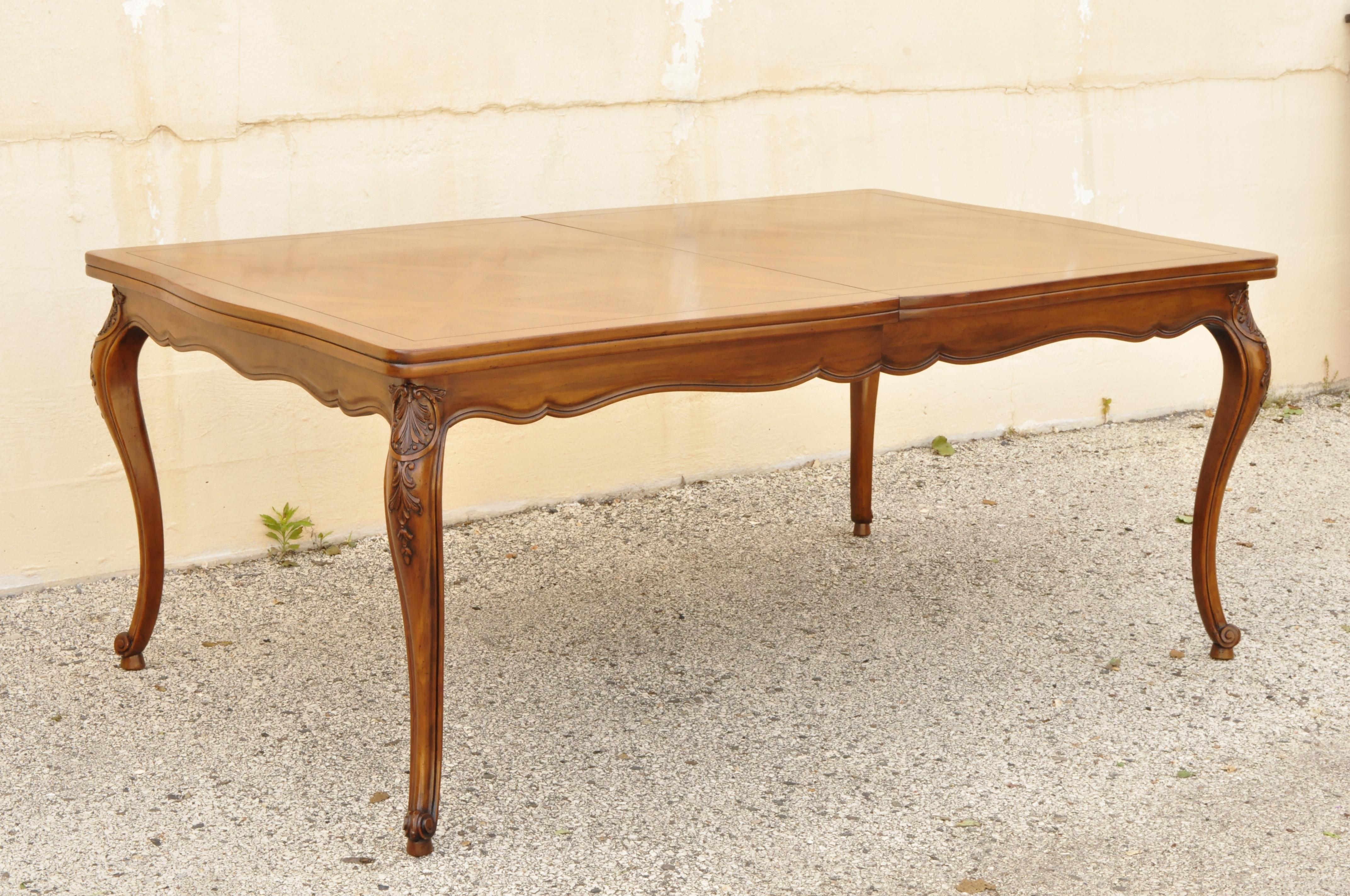 Country French Provincial Louis XV style parquetry inlay walnut dining table attributed to Henredon. Item features (3) 17