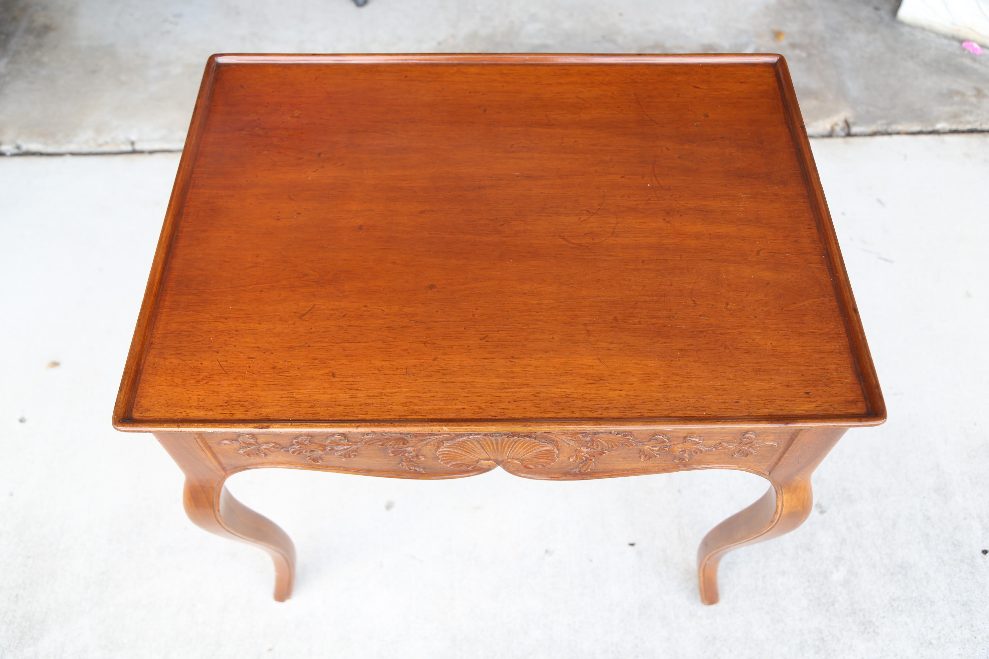 Country French tea table with carved shell motif on apron. Single drawer on one side.
