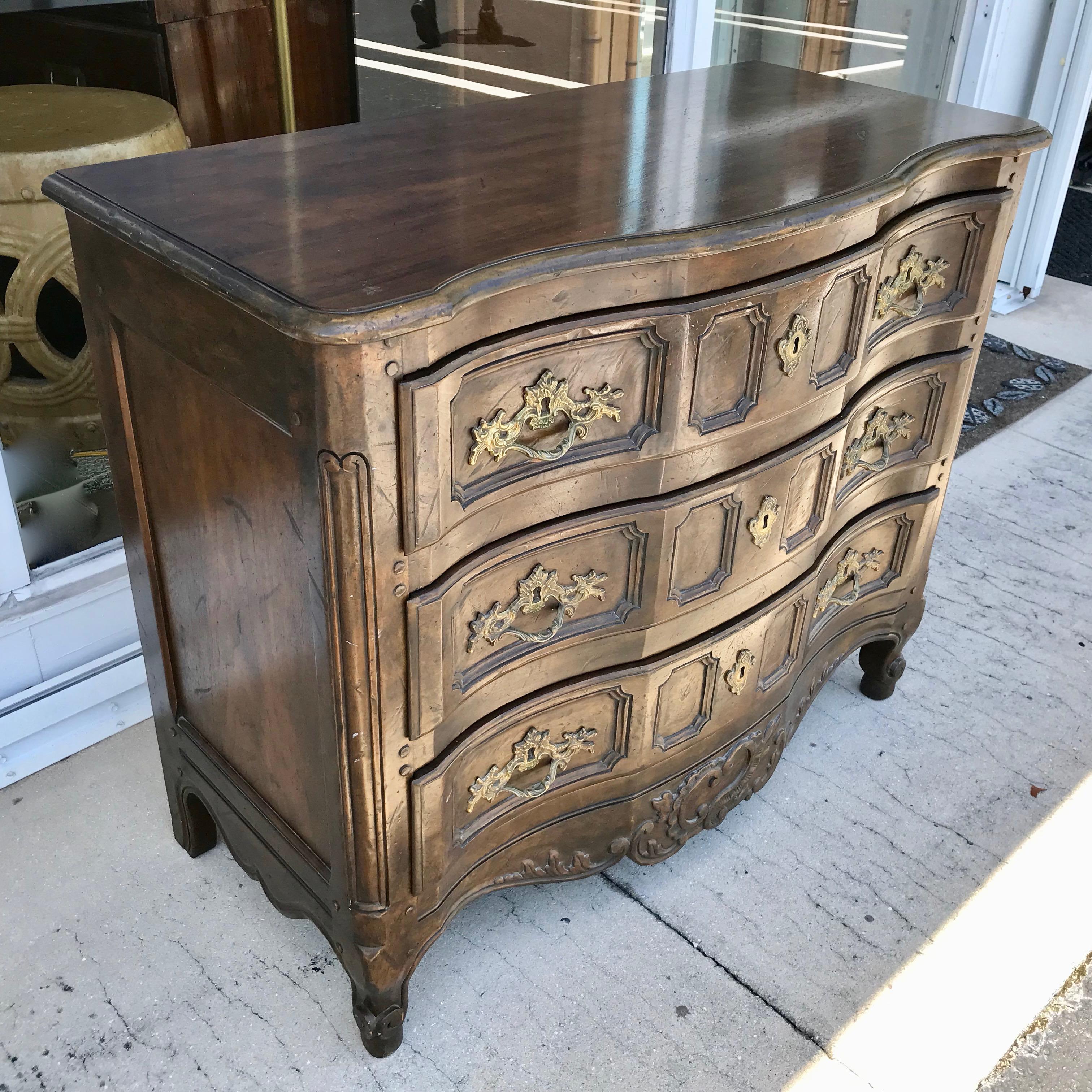 Beautiful deep carving, nice patina, and excellent brass accent 
this Baker 