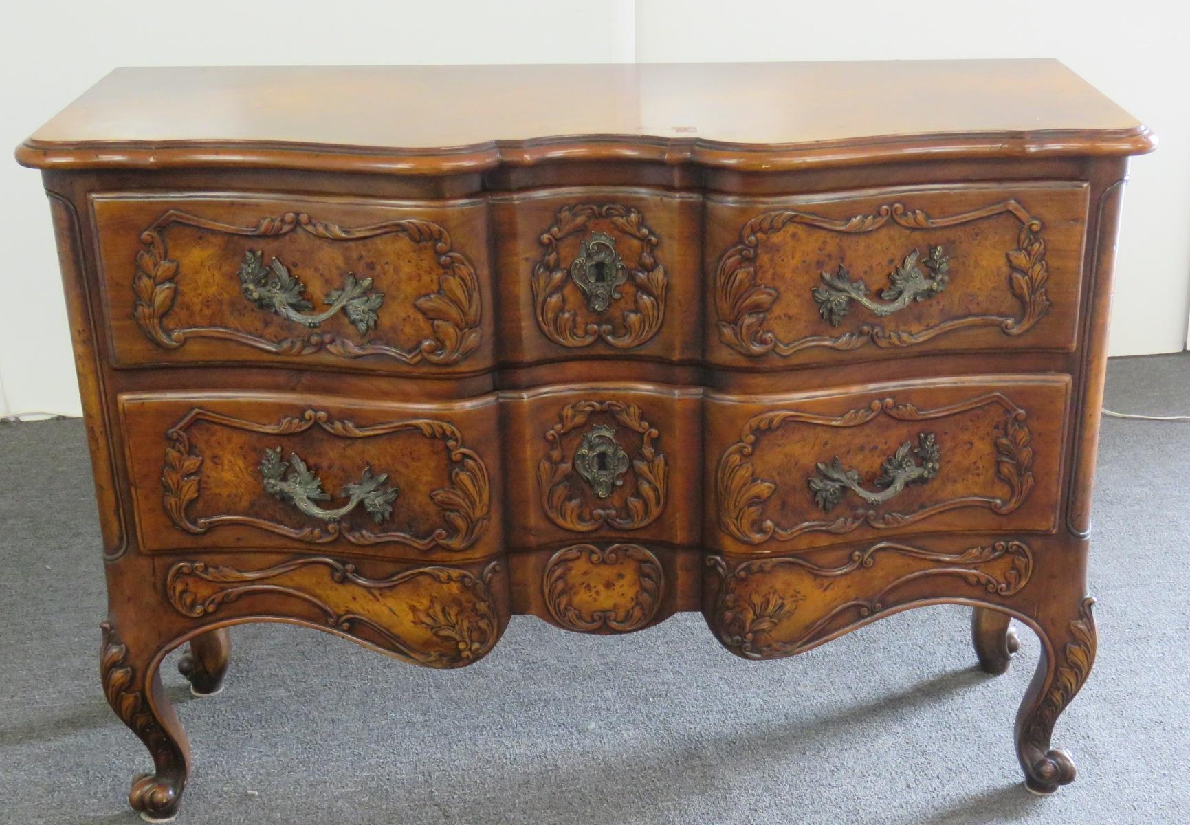 Country French style 2-drawer walnut commode with claw feet.