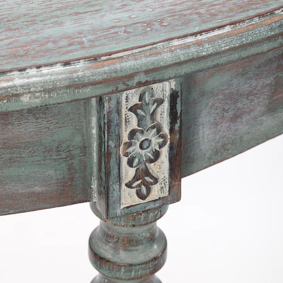 Elegant and exquisite in a silvery blue wash with hints of fir wood peeping through, this half circle console table sits snugly against a wall and is the perfect fit for any hallway or entrance foyer. It has plain aprons that allow the delicate