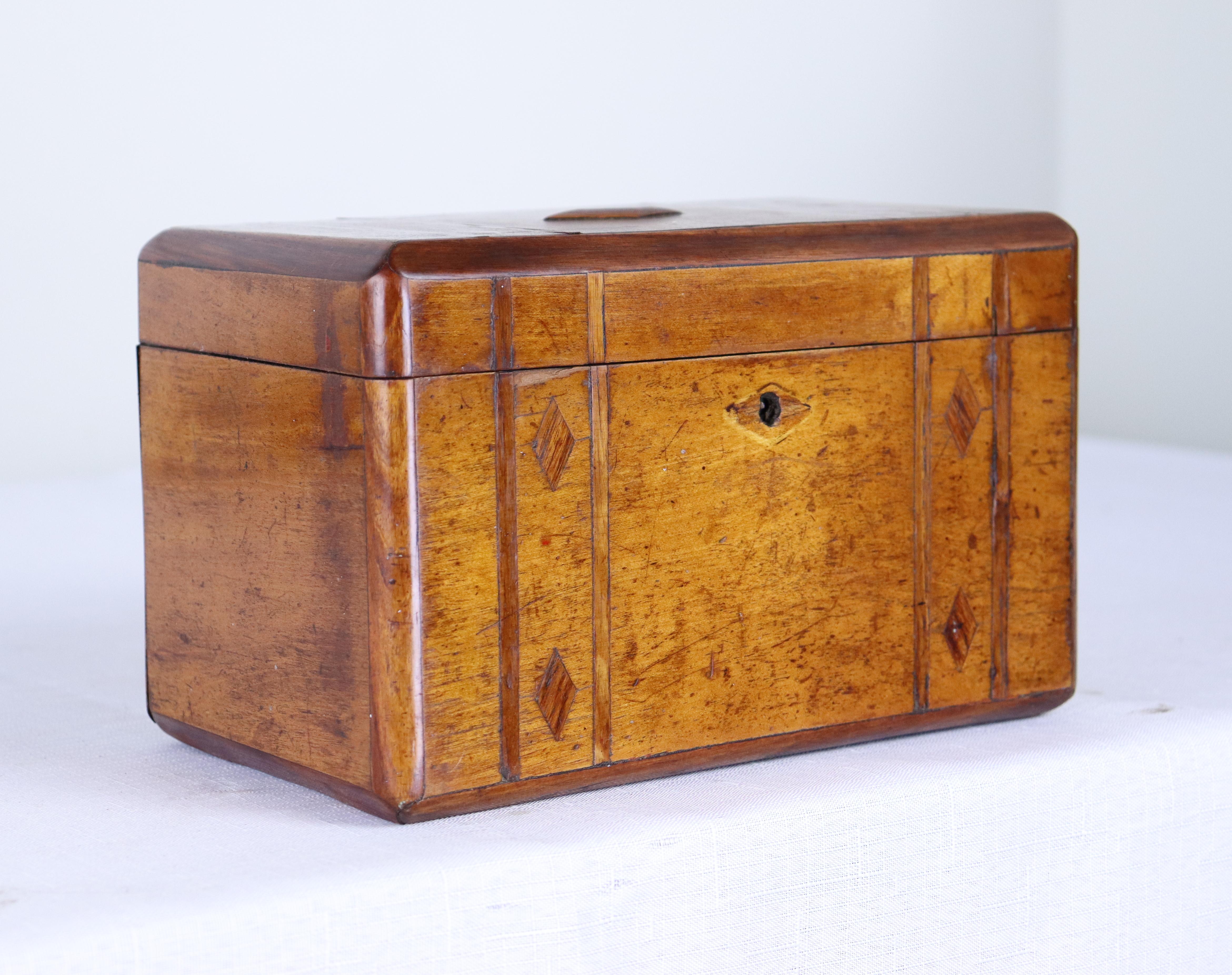 A sweet fruitwood tea caddy or decorative box, inlayed with light mahogany. No key.