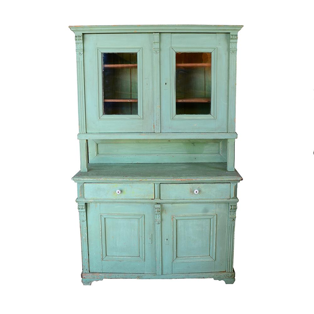 This early country style hutch has beautiful color and great character. A single unit step back style piece, it has some carved accents which add depth and interest to the overall homey aesthetic. Retains original wavy glass and hardware.