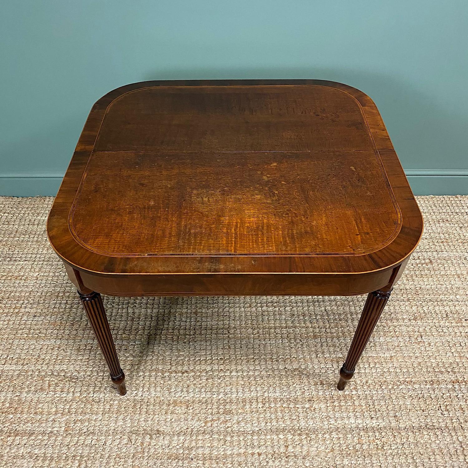 Dating from ca.1800 this Country House early 19th century Georgian Antique Side Table / Tea Table is very unusual as it is made from Oak and Mahogany. It has a beautifully figured D shaped top with rounded corners. It has an oak centre with Mahogany