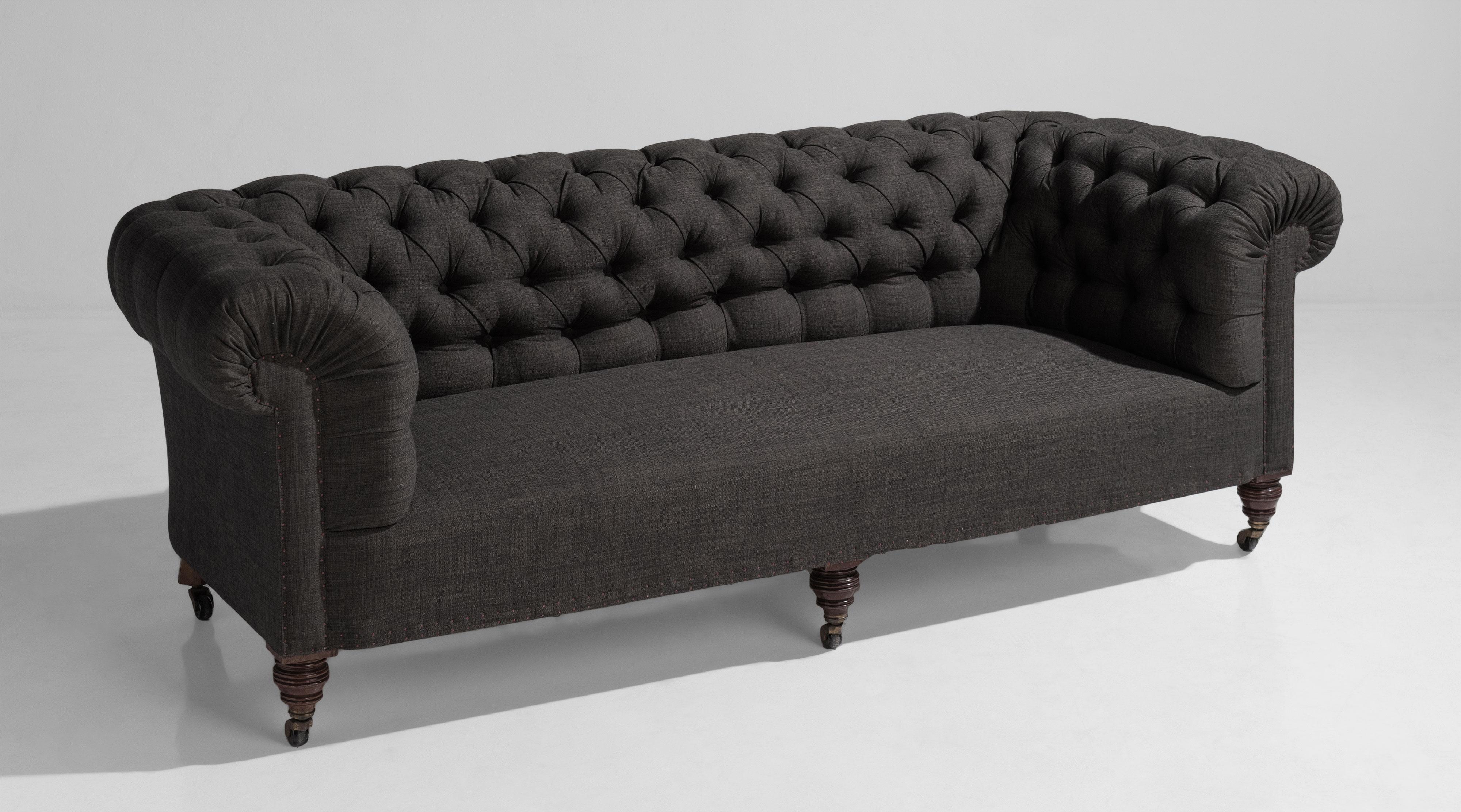 Country house chesterfield sofa, England, circa 1890.

Newly upholstered on original turned walnut legs.