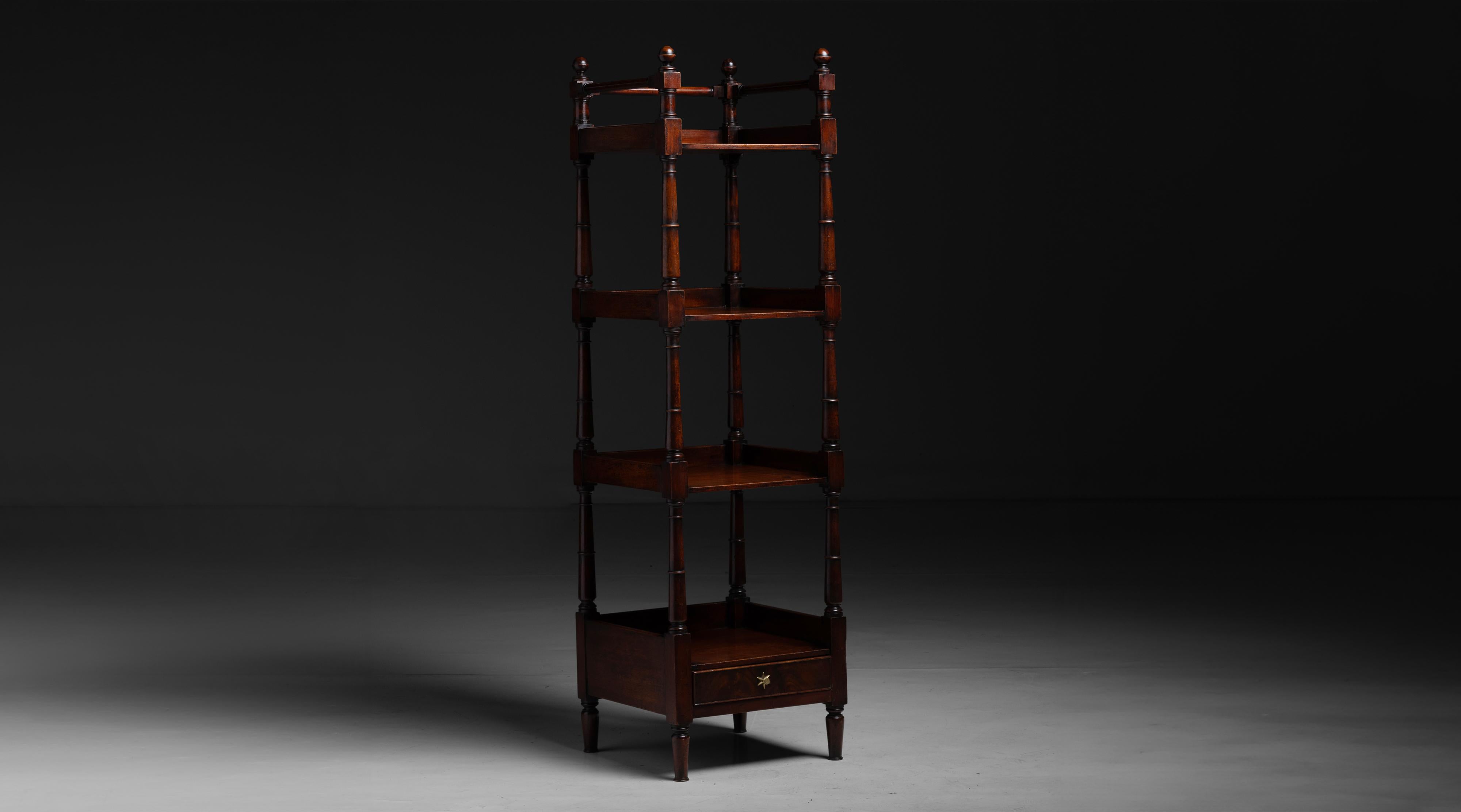 Country House Etagere

England circa 1900

Library etagere in mahogany with fitted drawer on the base.

Measures 17.5