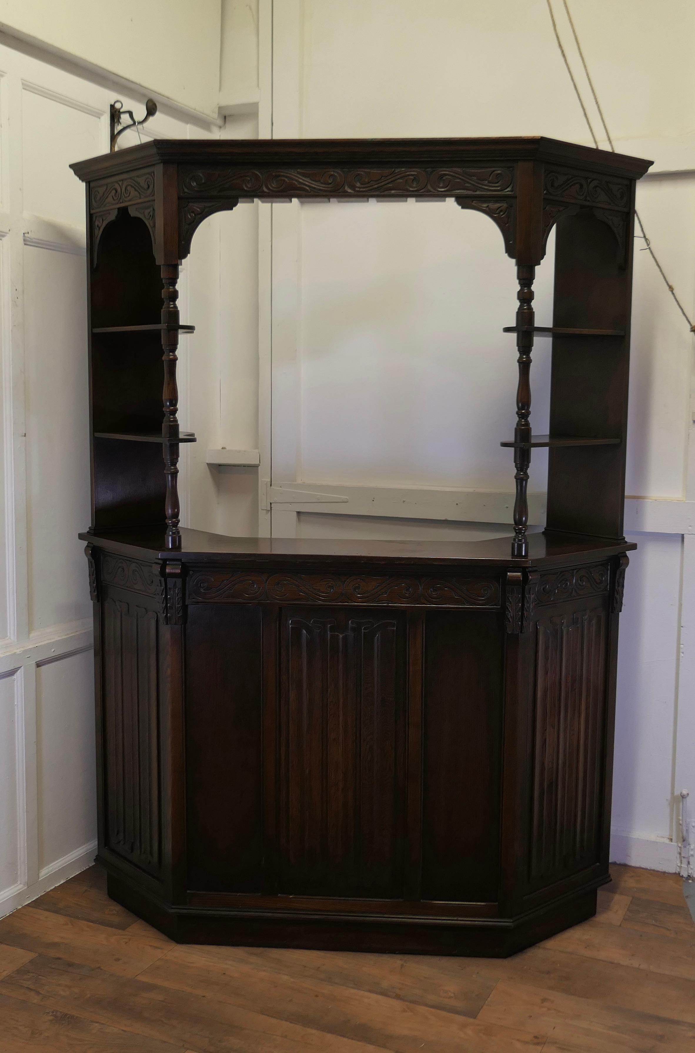 Country House Hostess Greeting Station, Reception Bar

A superb and traditional piece, the bar comes from a Country House Hotel, it is made in linenfold carved oak in the Gothic style, it has a 3 sided front counter and shelves at the sides. From