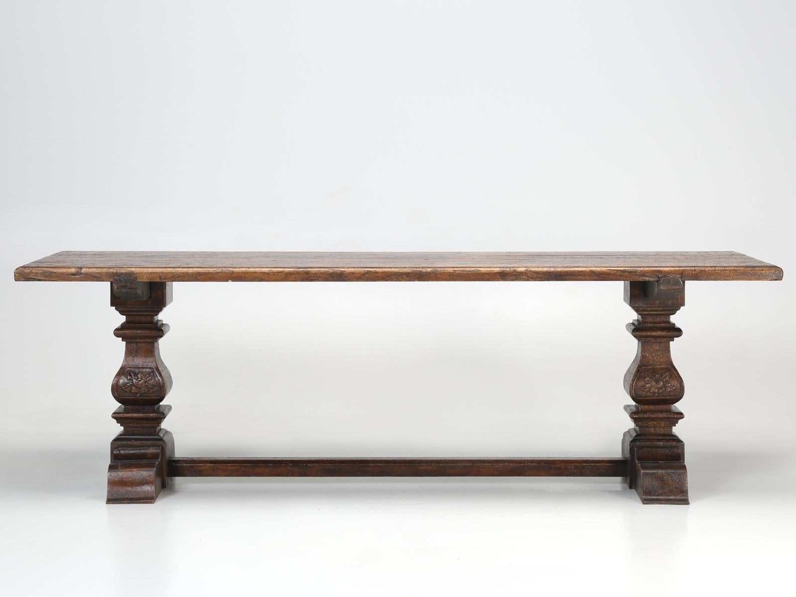 Country Italian trestle dining table, constructed from solid elmwood. Since our Country Italian style farm table, had been previously restored, prior to our purchase, there is little way for us to determine the Italian dining tables true age.