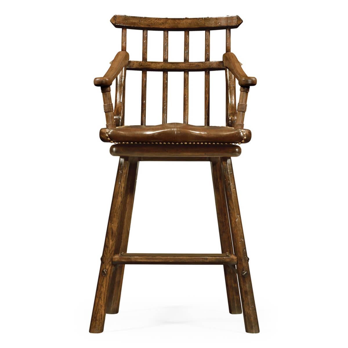 Heavily distressed dark oak armchair barstool with a batoned back, sweeping arms supported on ring turned uprights, shaped supports, and a studded leather revolving seat. The legs with tapering hexagonal cross-section.

Dimensions: 24.75