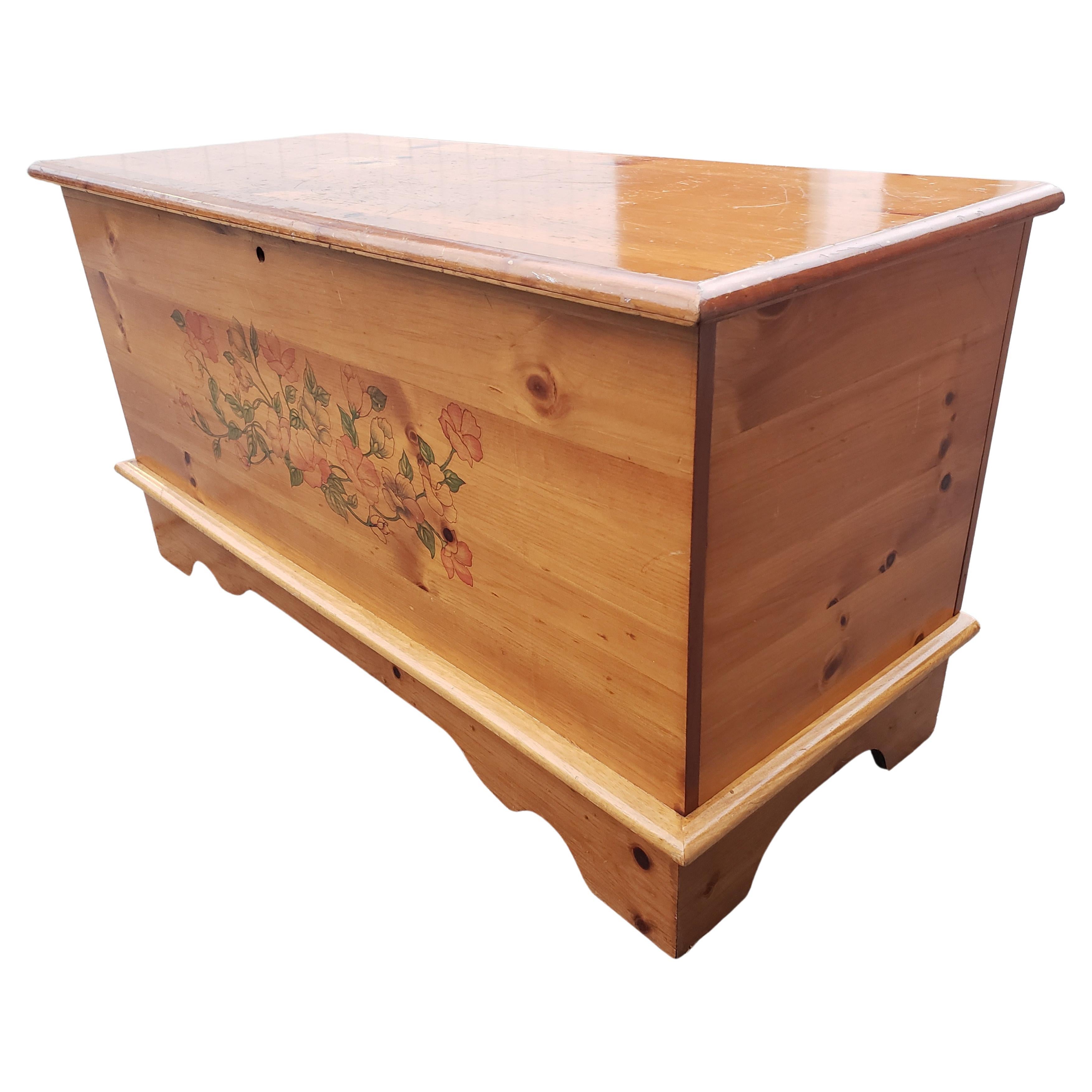This brilliant Cedar Trunk chest is made of cedar wood, pine cedar, and is in good vintage condition. This exquisite cedar chest has great Traditional style with a classic silhouette, interesting features such as beautiful flower hand painting in