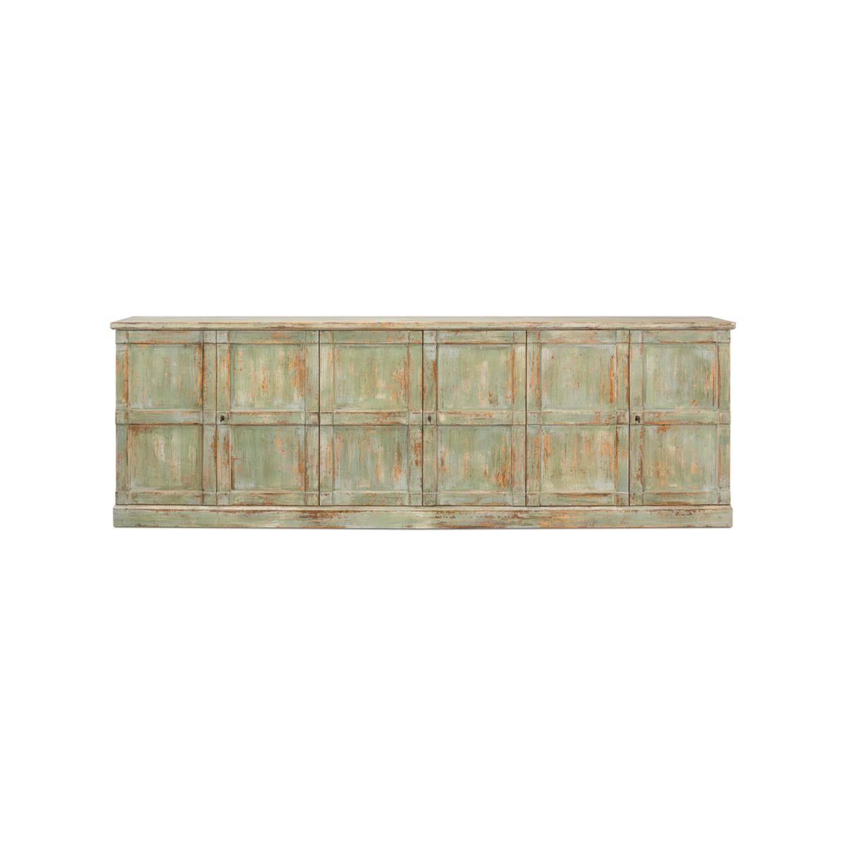 Made of pine finished in a sage finish that is antiqued and distressed. With six doors, a rectangular form and a perfect depth of 15