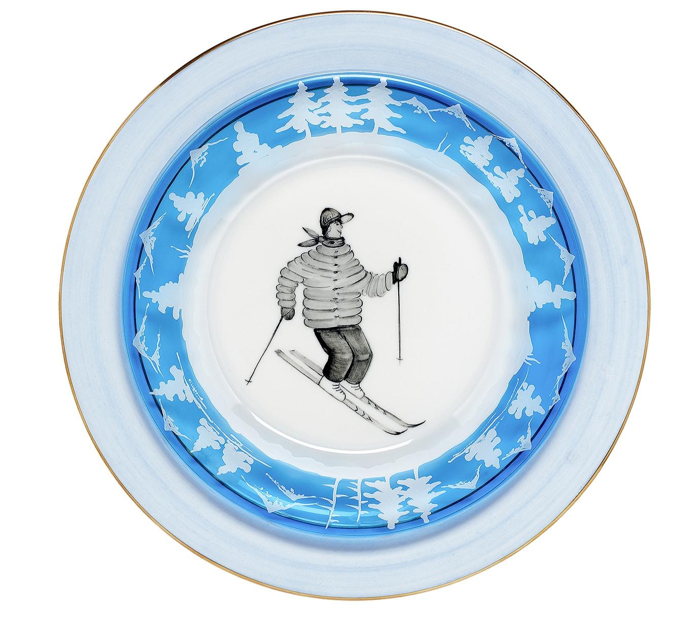 Set of six plates in blue crystal with a skier decor all around. The charming country decor is hand.-engraved and shows sladder, skier, ice skater with trees all around the plate. The glass plates can be ordered in different colors. All Sofina glass