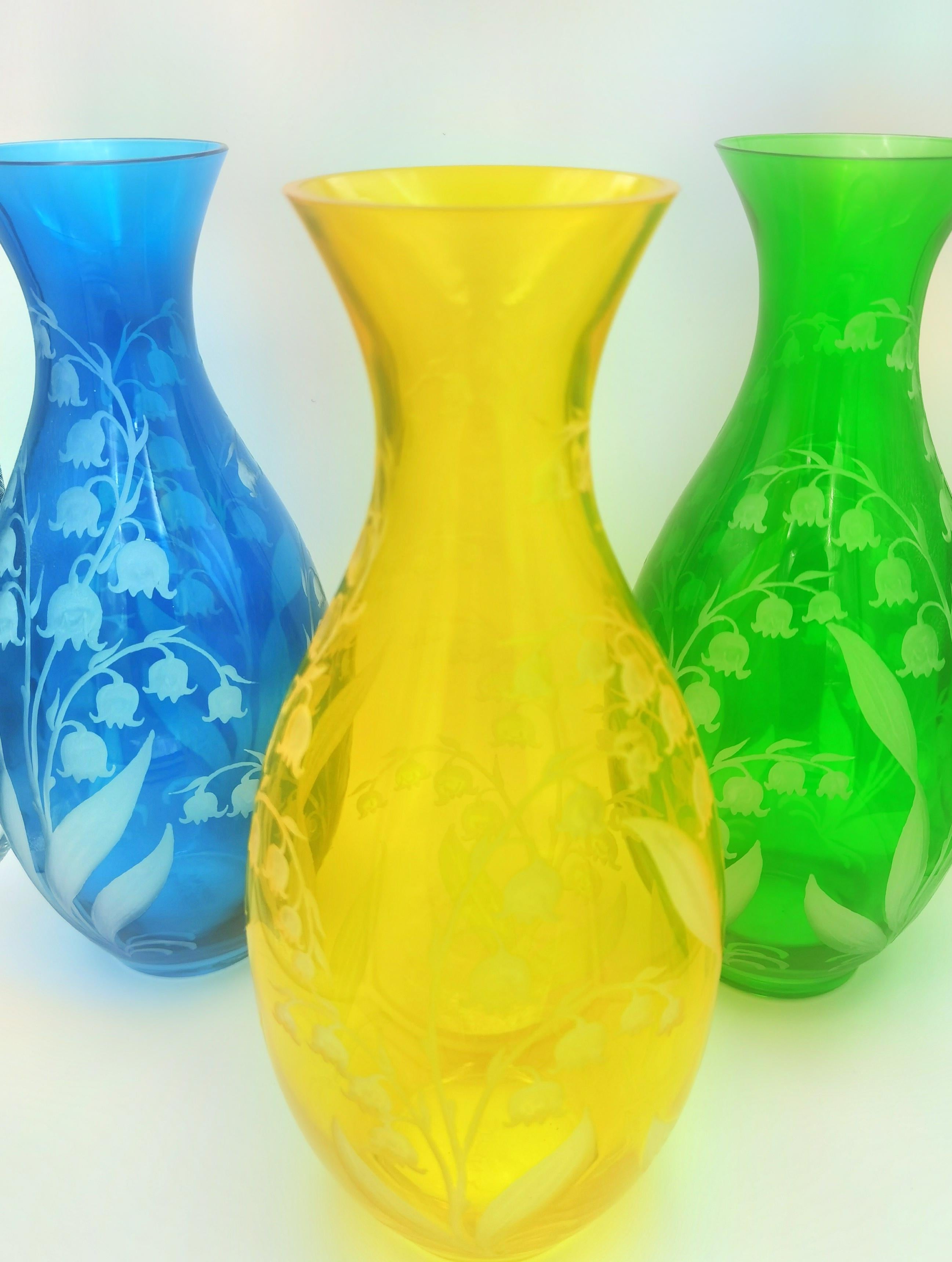 Hand blown carafe in yellow crystal with a hand-engraved country style decor Lily of the Valley all around. Handmade in Bavaria for Sofina Boutique Kitzbühel Austria. A matching vase and tumblers are available. Can be ordered in different colors.