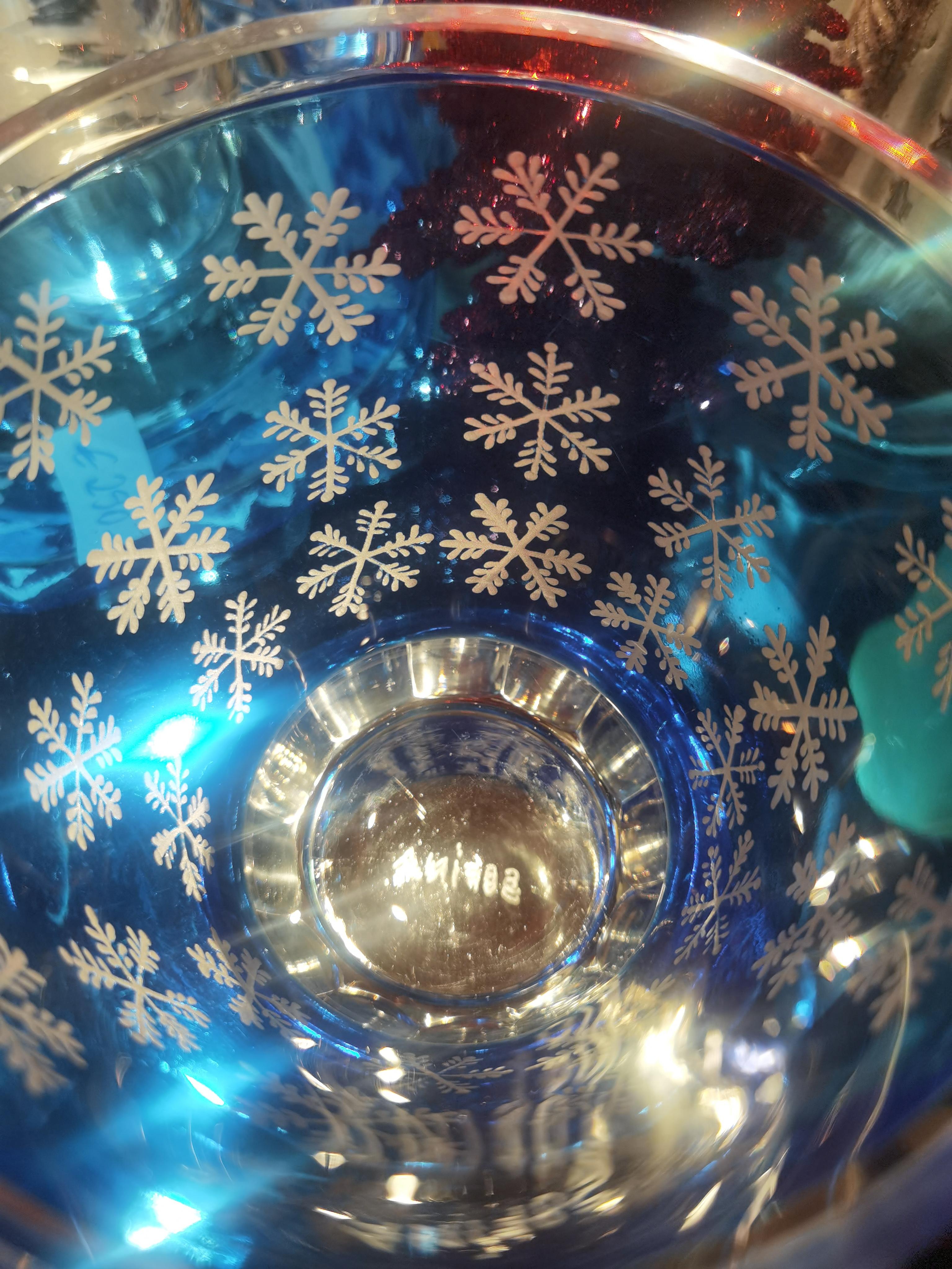 Crystal votive hand blown in blue crystal. The glass is hand-engraved with a winter decor snowflakes all around. The glasses are signed by Sofina in the bottom. Completely handmade in Bavaria by glass artists. A matching carafe can be ordered