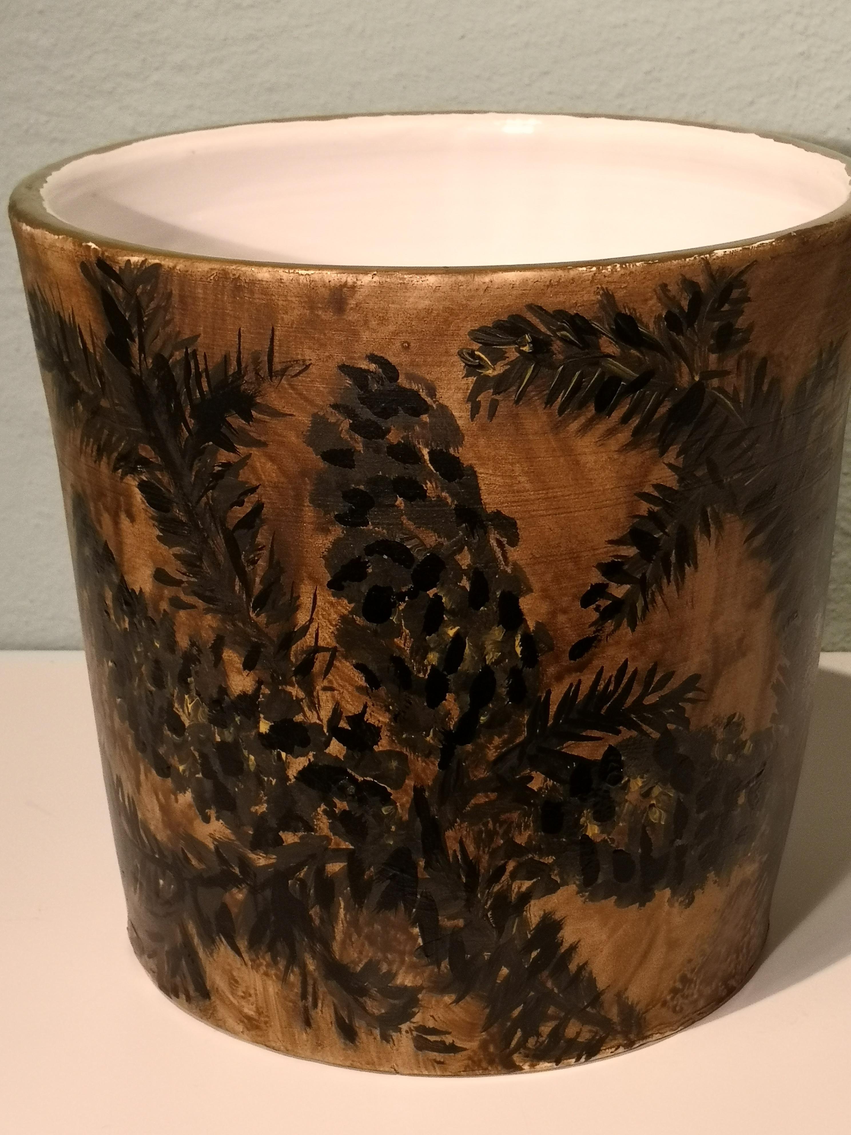 Completely handmade pottery vase in earthenware. Formed by hand in a strong straight form. Hands-free painted with a naturalistic pine decor in green and brown colors. Rimmed by hand with a gold line. Inside white glazed. In the bottom signed by the
