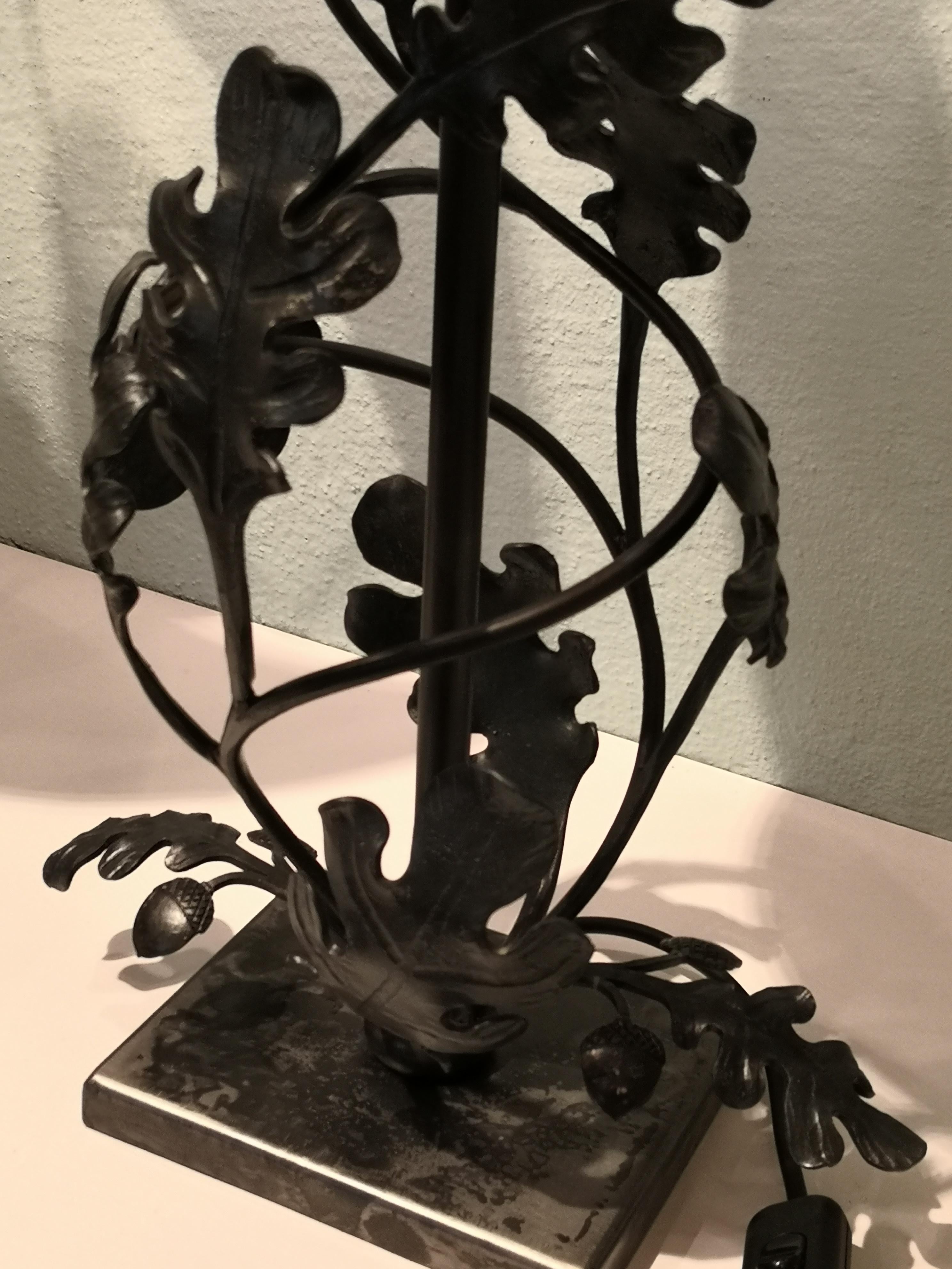Handmade pair of Austrian brushed iron table lamps in the form of sculptural oaks and oak leaves. The lampes are entirely handcrafted by an Austrian blacksmith for Sofina Boutique KItzbuehel. The leaves and oaks are hand forged in iron and brushed.