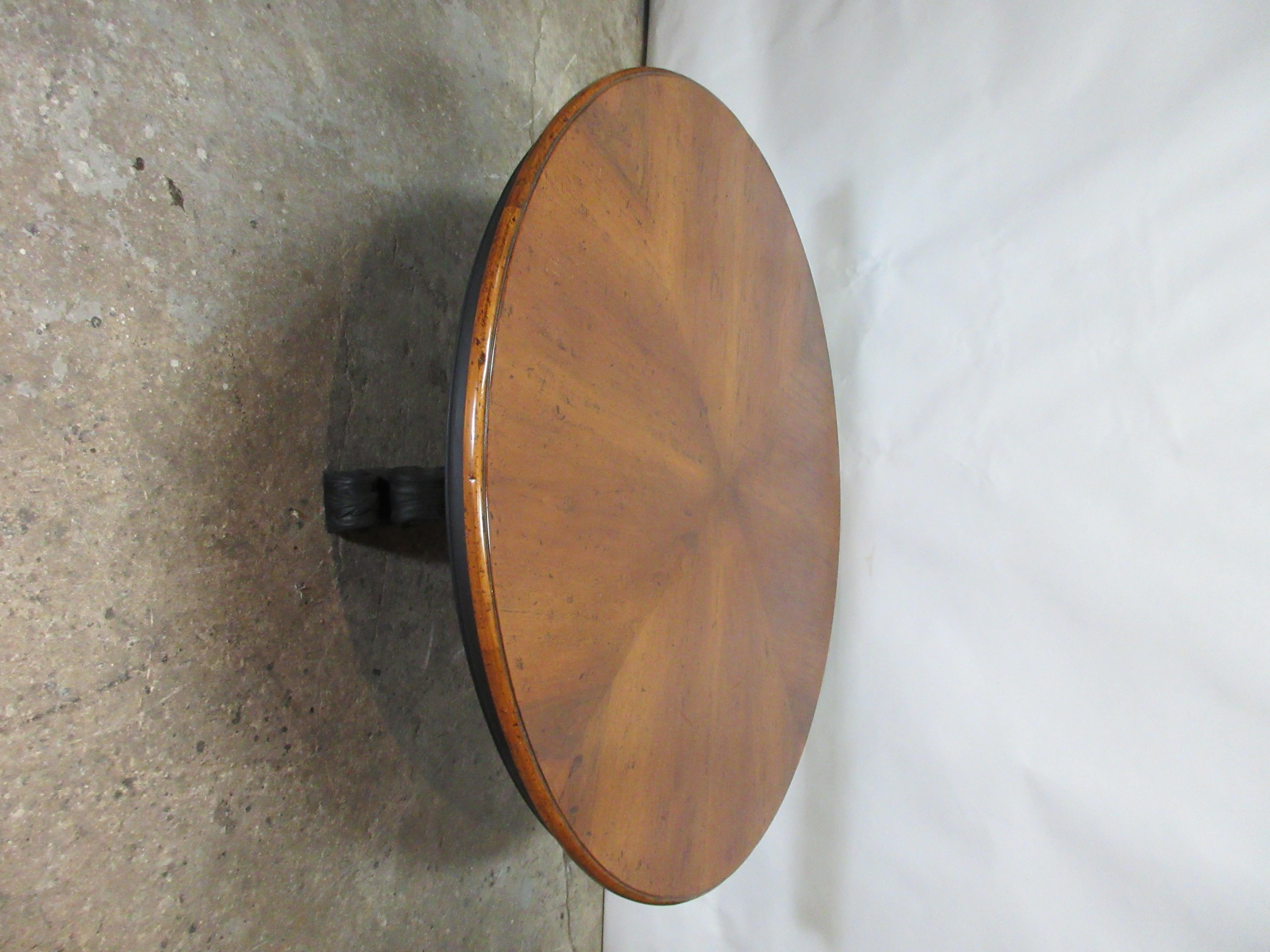 This is a country style round dining table. Its been restored and the bottom half has been repainted with Milk Paints 