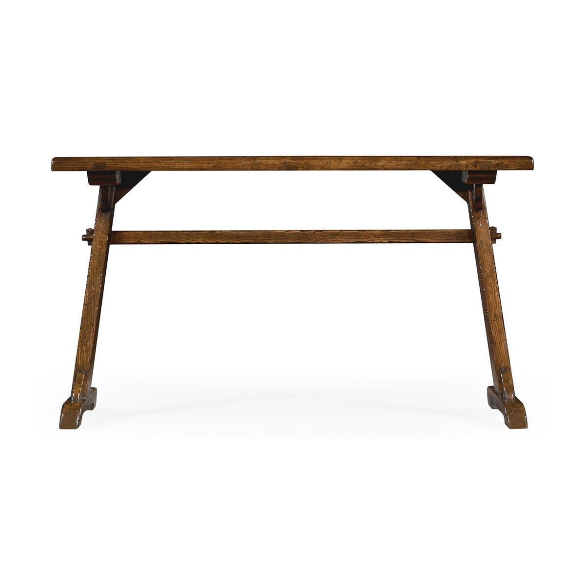 Country tavern table with a distressed country style dark oak with a planked top set over trestle ends and sled-type feet. 

Dimensions: 52