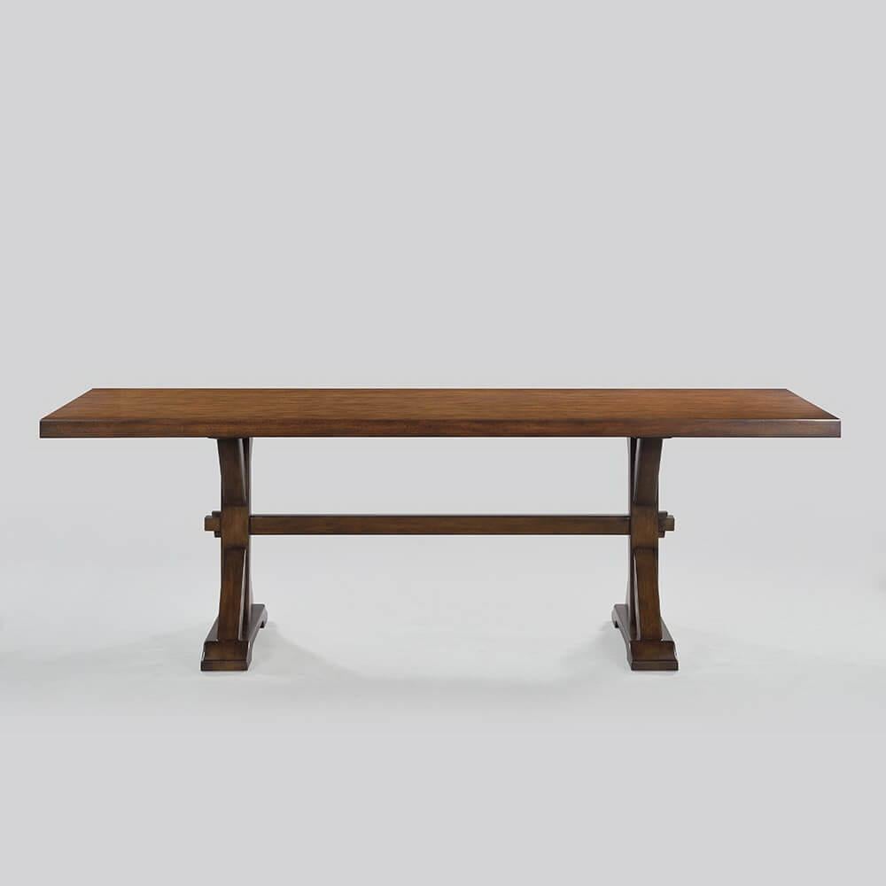 Rustic country trestle dining table with chunky “K” shaped base, smooth, thick top, slightly raised base and strong stretcher has a “rustic” warm brown walnut finish with subtle visual distressing and hand-rubbed finish.

Dimensions: 92