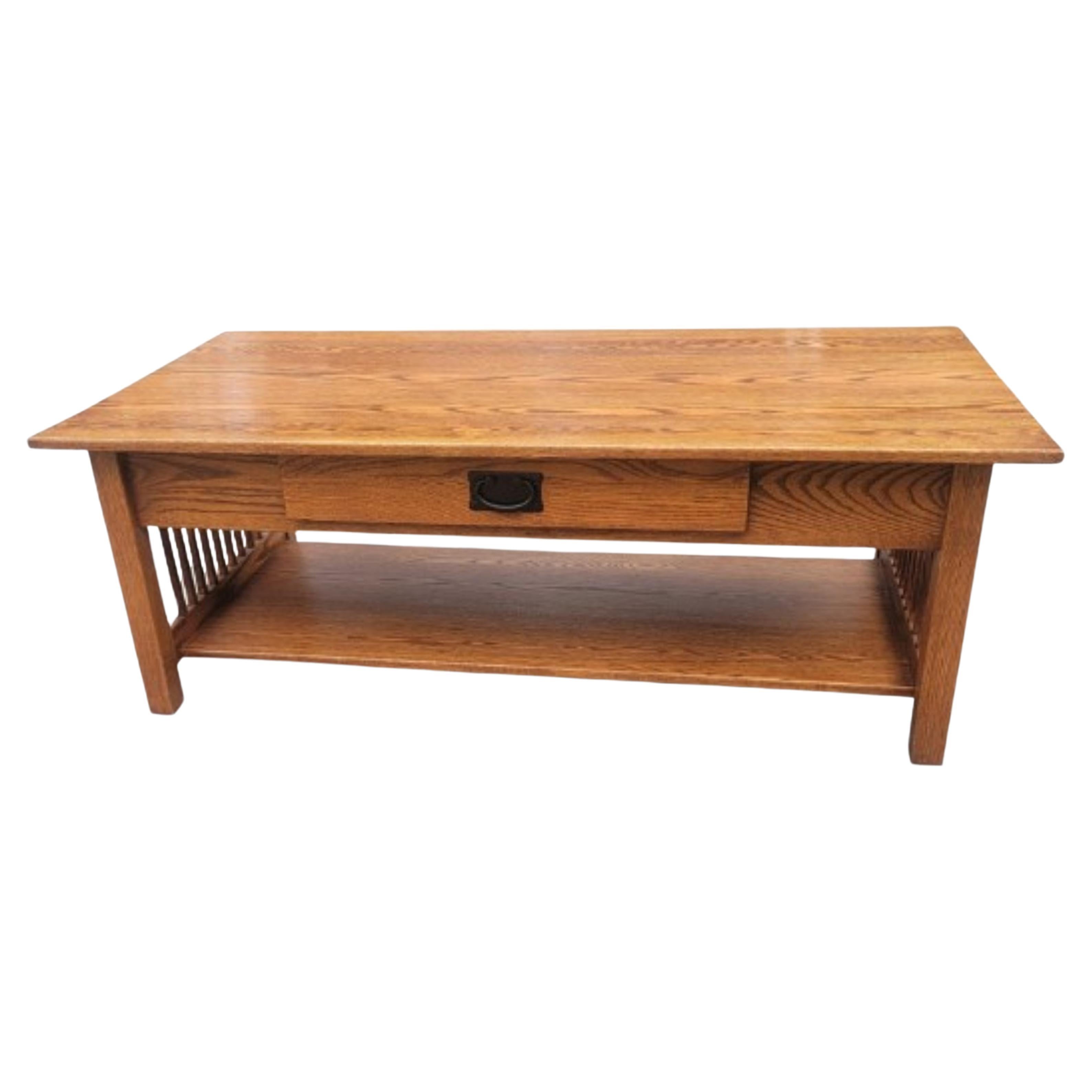 A solid Amish handcrafted Arts & Crafts style Mission oak coffee or cocktail table by country view woodworking.
Handcrafted in Ohio USA by the finest Amish artisans. Rock solid tables in excellent vintage condition. 
Measures 50