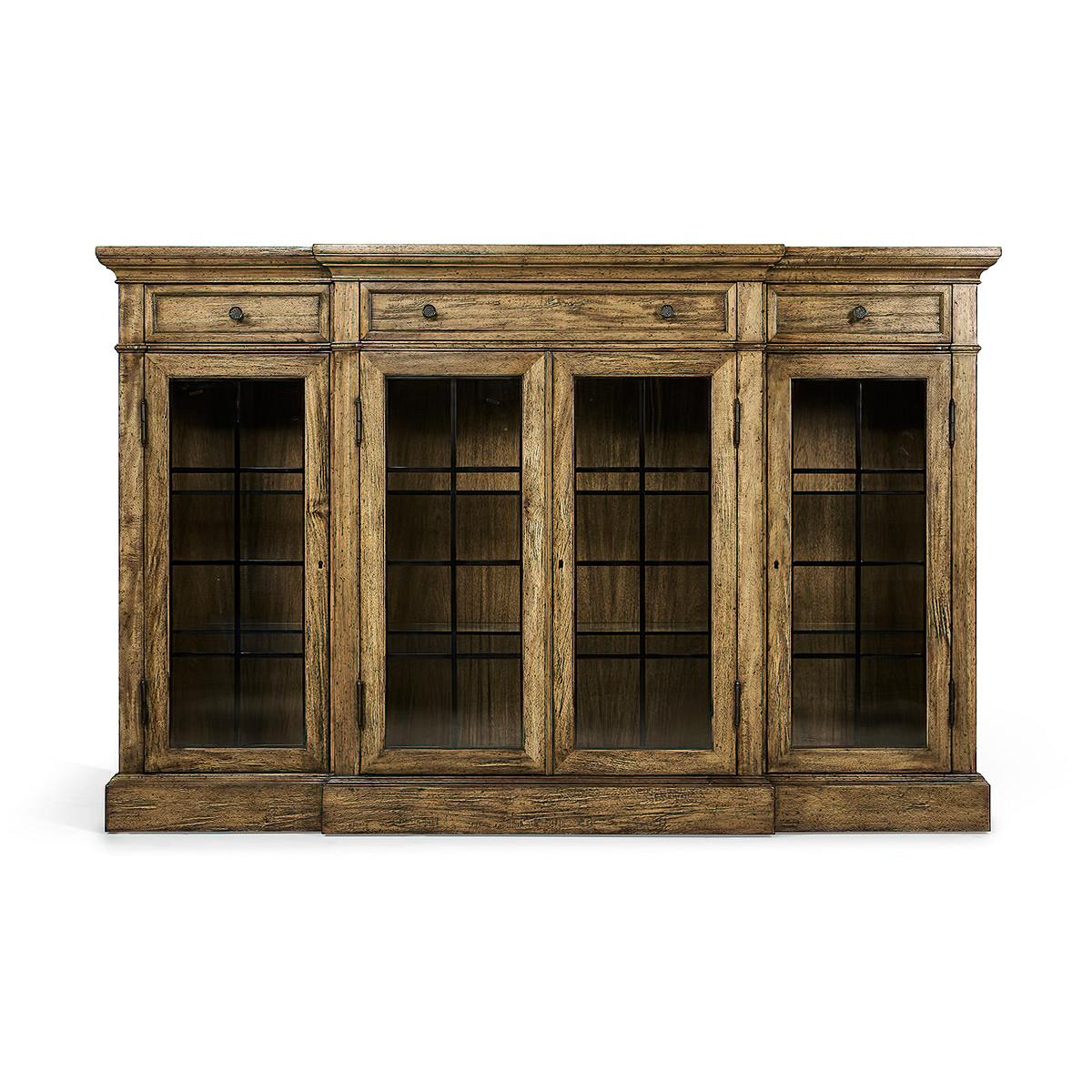 Country walnut four-door breakfront display cabinet in our medium driftwood distressed finish with interior lighting. The glazed doors flanked. Three shallow drawers at the top with brass handles.

Dimensions: 77 