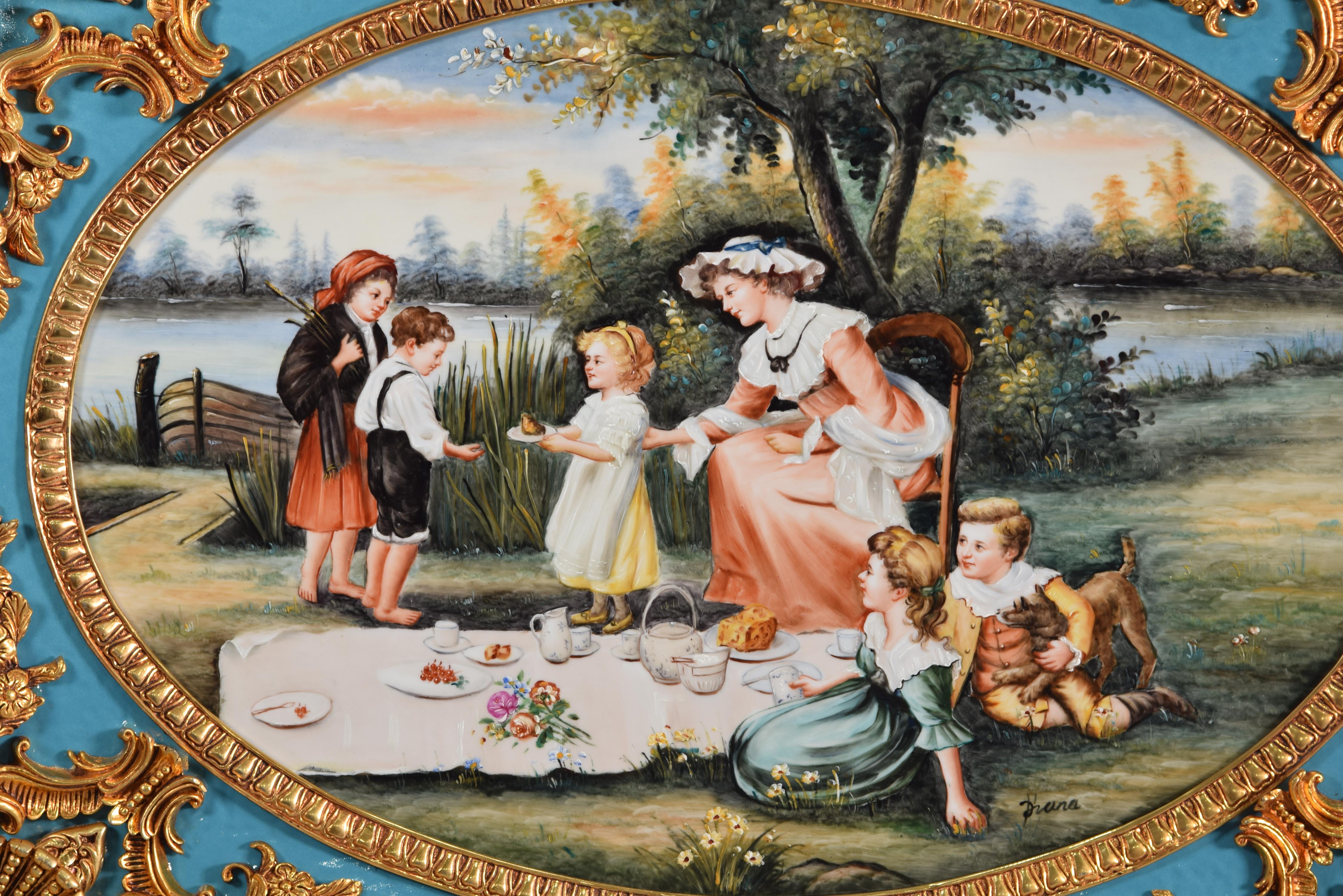 Country scene. Oil on porcelain. 
 A country scene has been painted in oil on a porcelain plate, enhanced with a frame decorated with elements of classicist influence common in 19th century European art. The scene shows a woman with three children