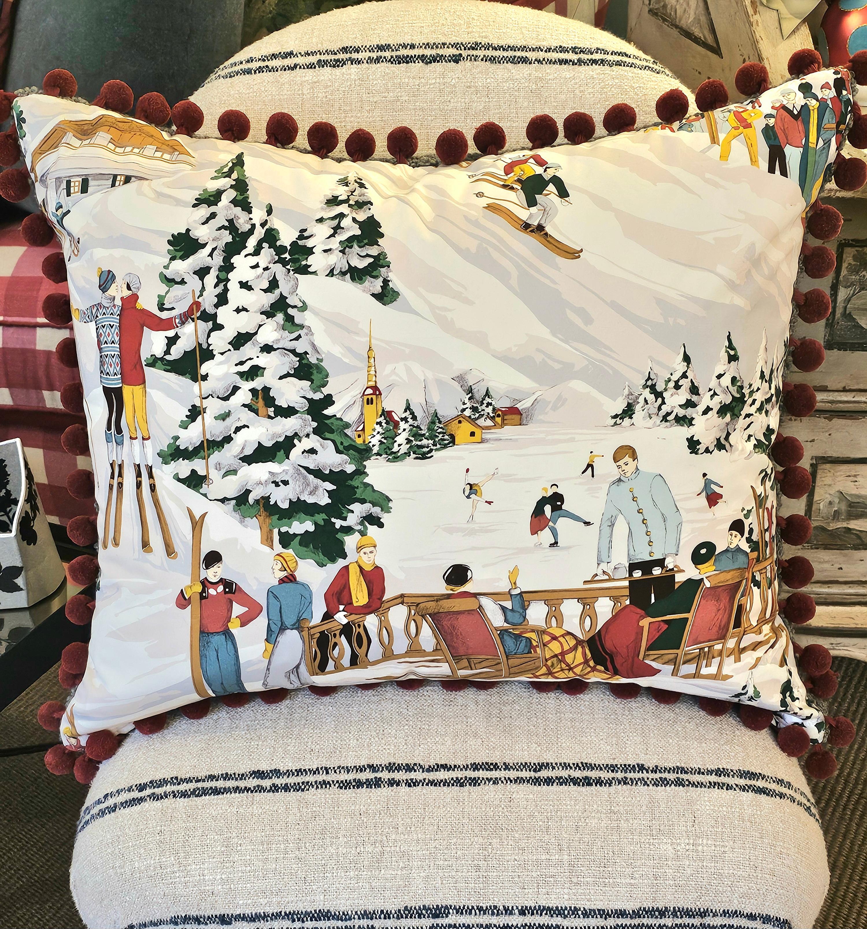 Country style cushion made from a Pierre Frey fabric in cotton with a skier scene. all round with red pompoms. Backside green wool.
Filled with real feathers. Perfect to combine with other cushions like fur, leather and wool queckers to create a