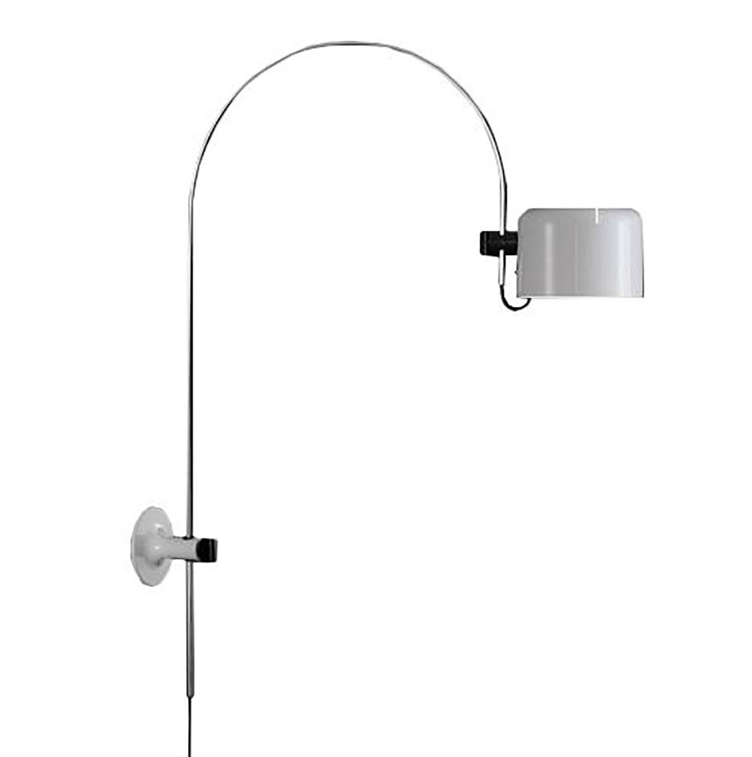 Coupe wall lamp (1158) designed by Joe Colombo for Oluce. Elegance defined by form following function is exemplified in this beautiful fixture. A round black plate is attached to the wall, into which the arm of the lamp is fixed. The arm is a long