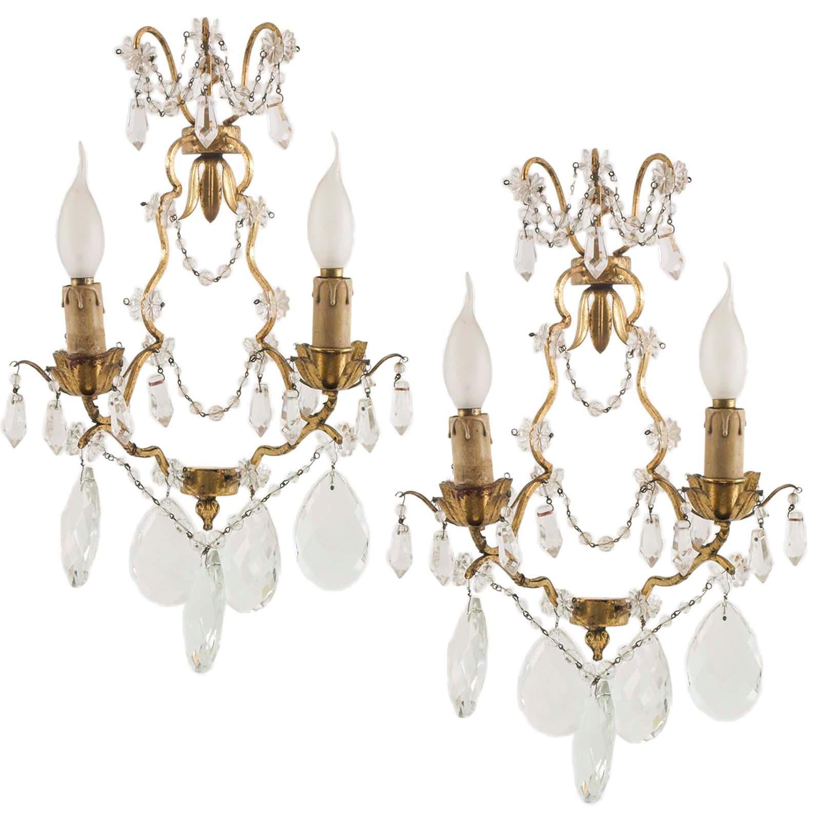 Two charming Maria Teresa sconce Swarovsky beaded that dates to the early 1900s. The sconce is detailed with an abundance of faceted drop pendants. The metal arms retain their original gold leaf. The tiny beading and faceted pendants have been