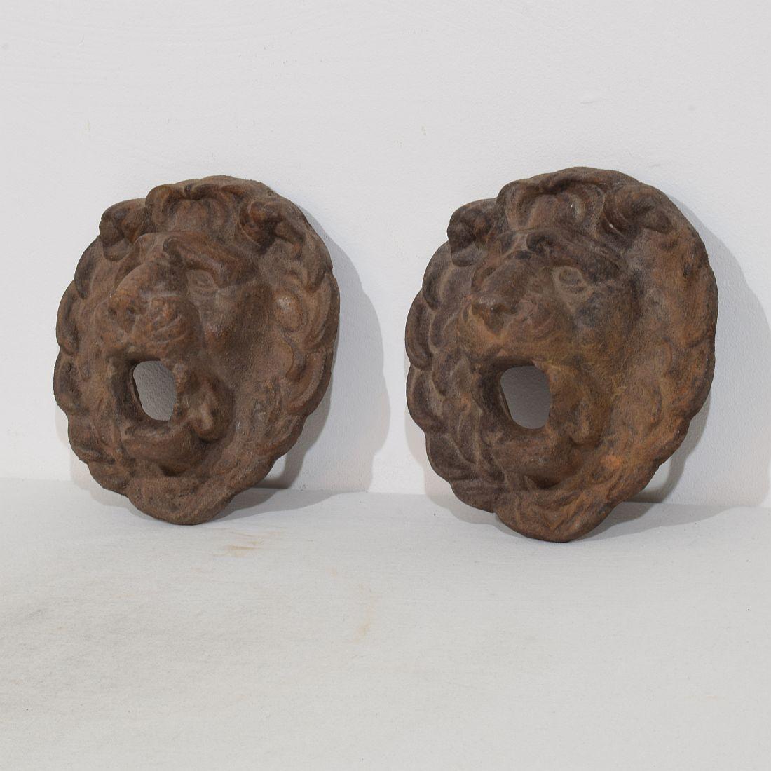 Wonderful and rare couple of small cast iron fountain heads with a great expression, France, circa 1850-1900. Weathered. Measurement is individual.
H:20cm  W:18,5cm D:8,5cm 
