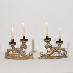 Couple of 18th Century Italian Baroque Carved Wooden And Silvered Candleholders