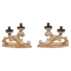 Couple of 18th Century Italian Baroque Carved Wooden And Silvered Candleholders