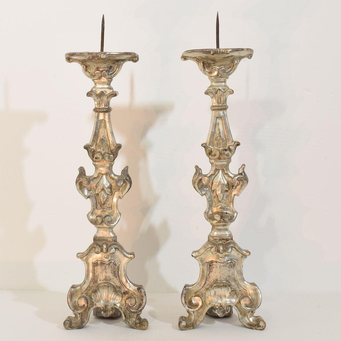 Hand-Carved Couple of 18th Century Italian Baroque Carved Wooden And Silvered Candlesticks For Sale