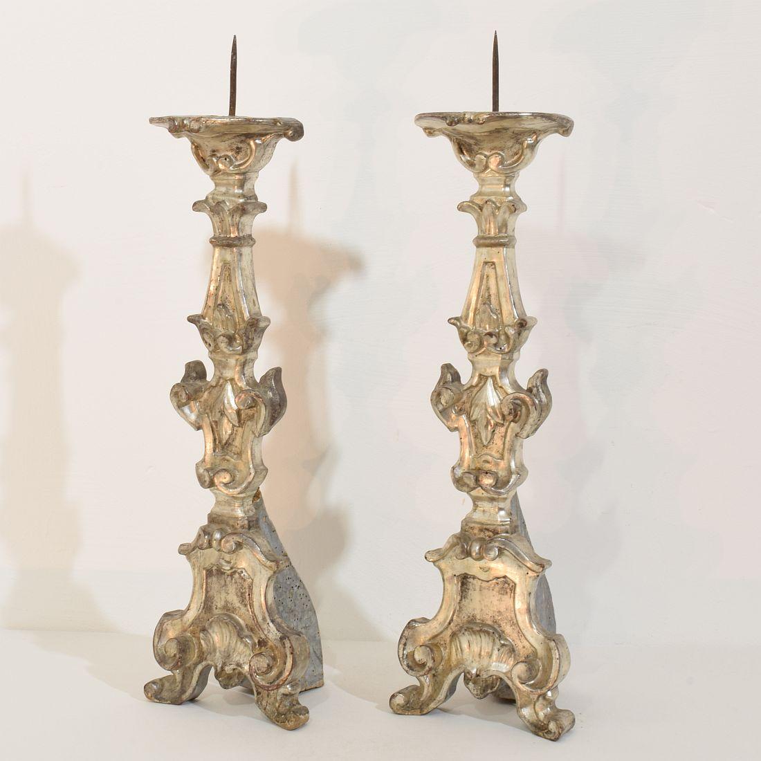Hand-Carved Couple of 18th Century Italian Baroque Carved Wooden And Silvered Candlesticks For Sale